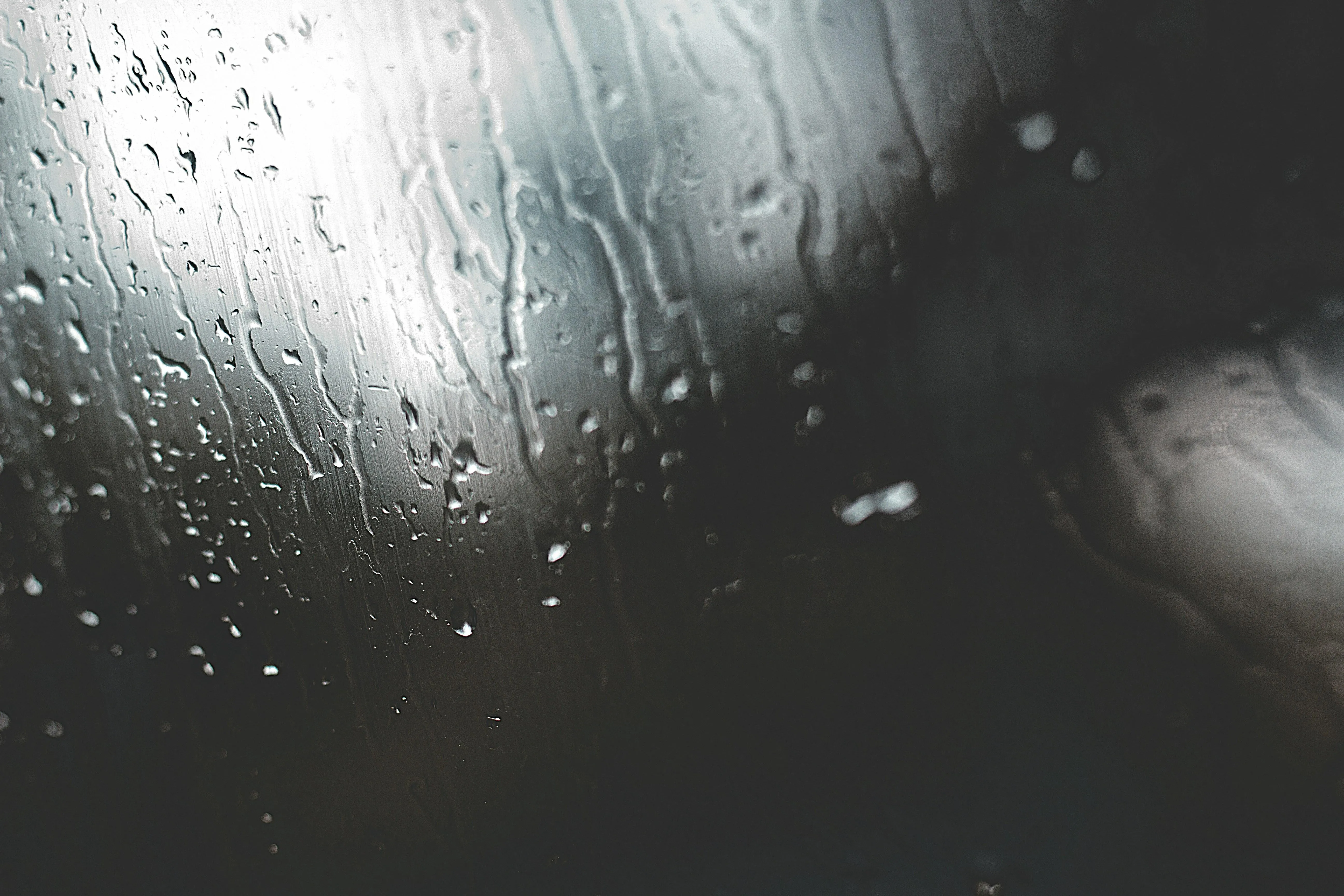 Water Droplets on Glass During Dark Rainy Night Wallpaper