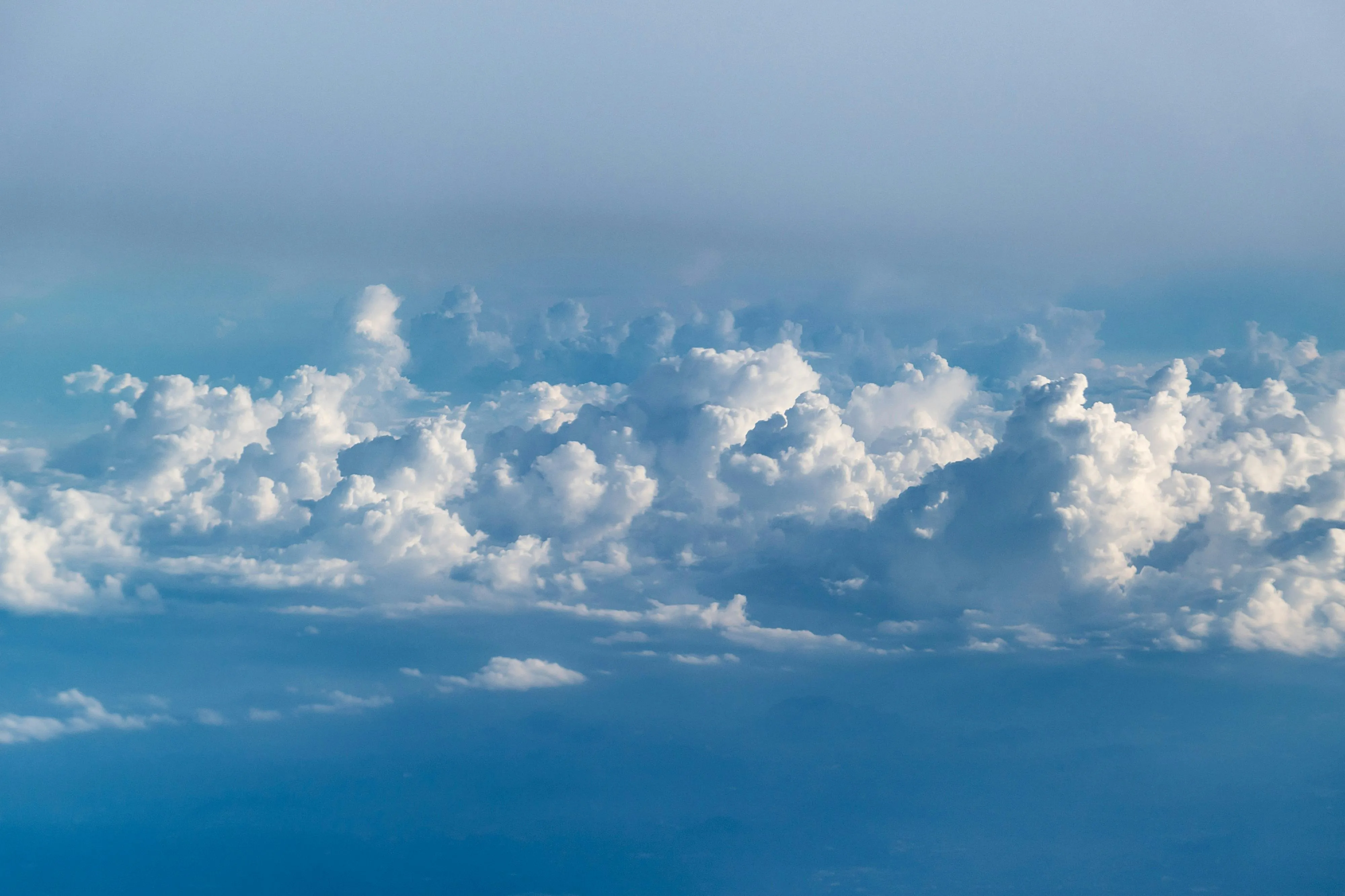 White Clouds Hanging Low Over a Blue Sky on a Sunny Day