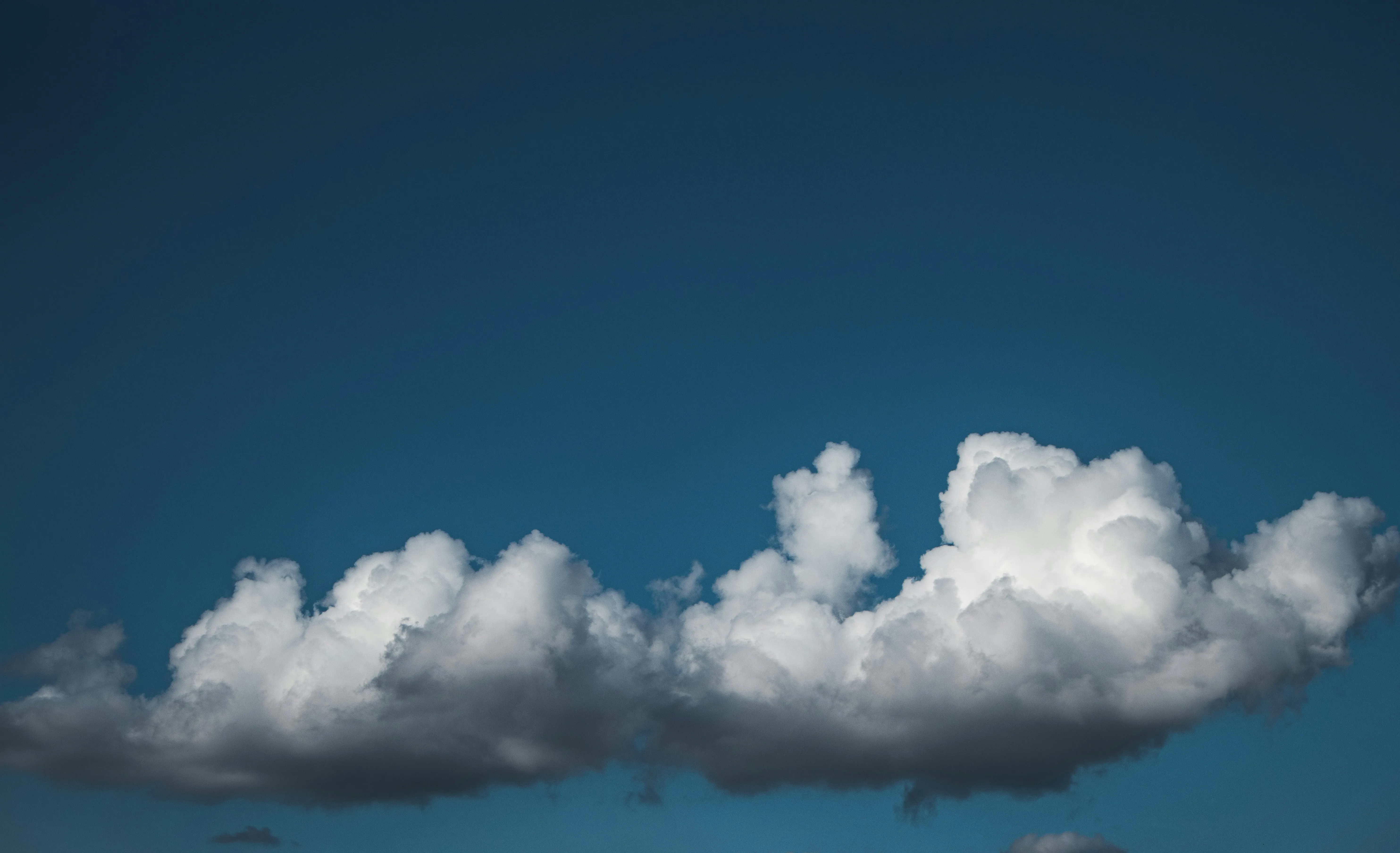 White Clouds Over Blue Sky in Peaceful Afternoon Light