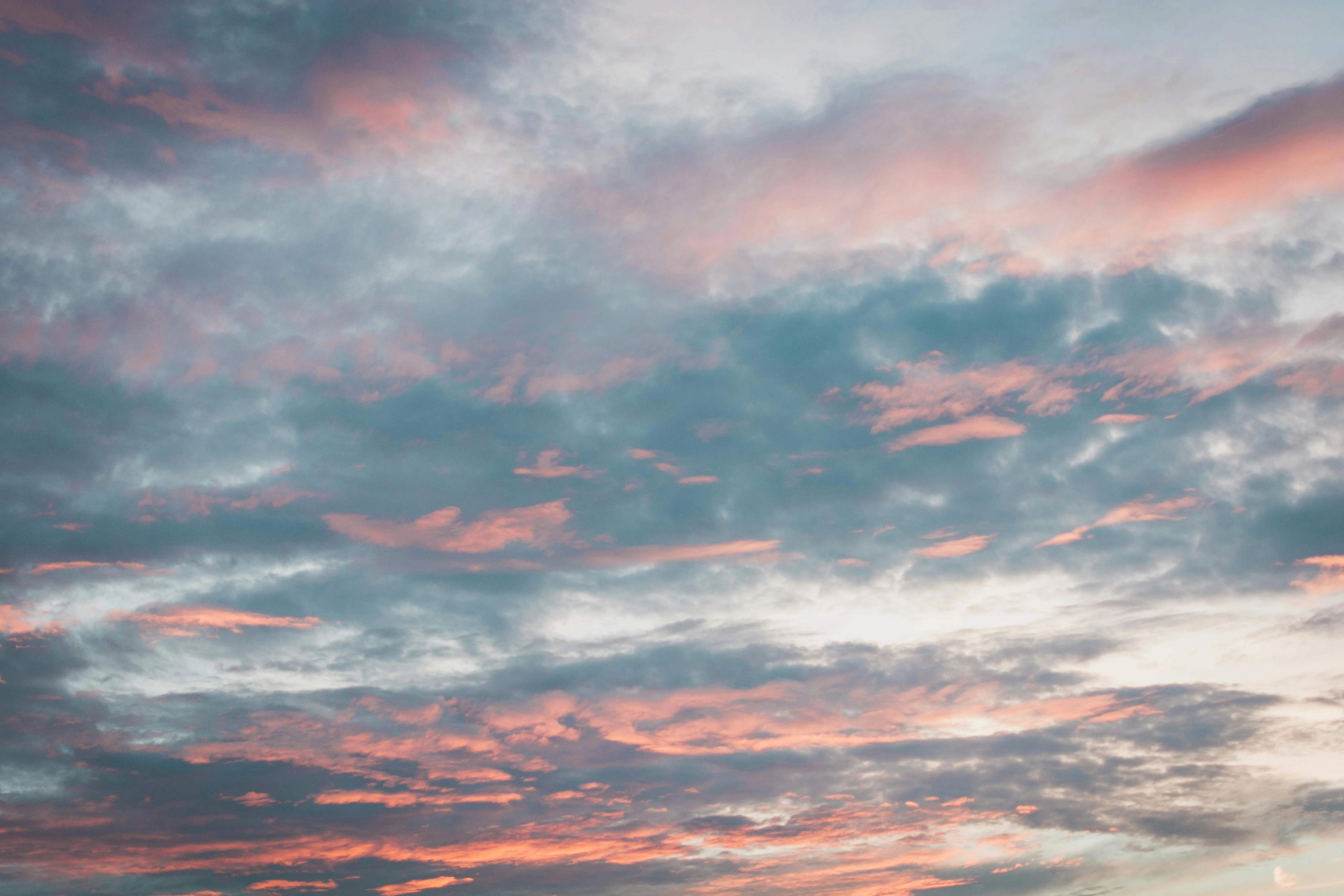 Wide Blue Sky with Streaks of Pink Clouds at Sunset