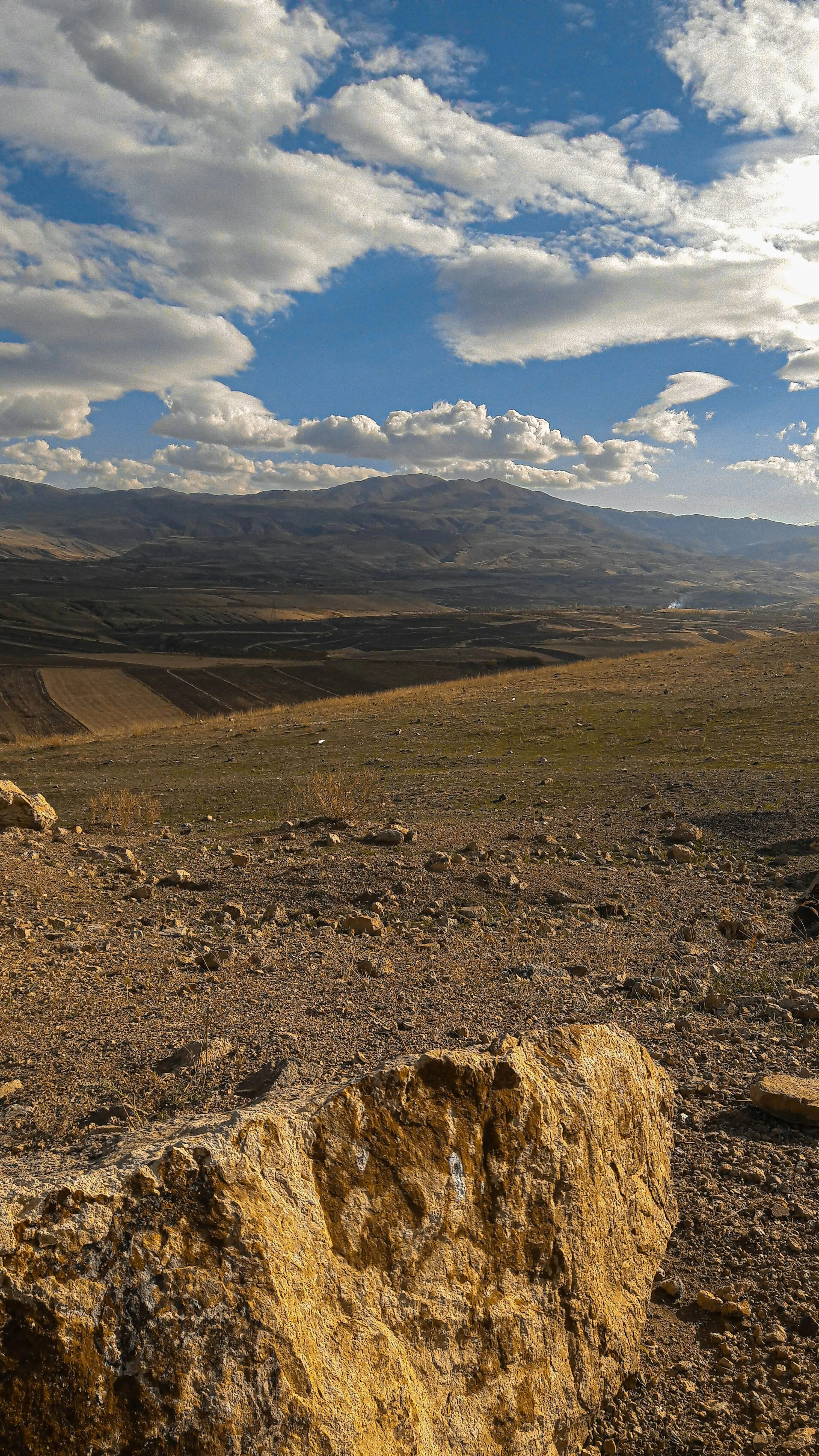 Wide Landscape View of Mountains and Cloud Filled Sky