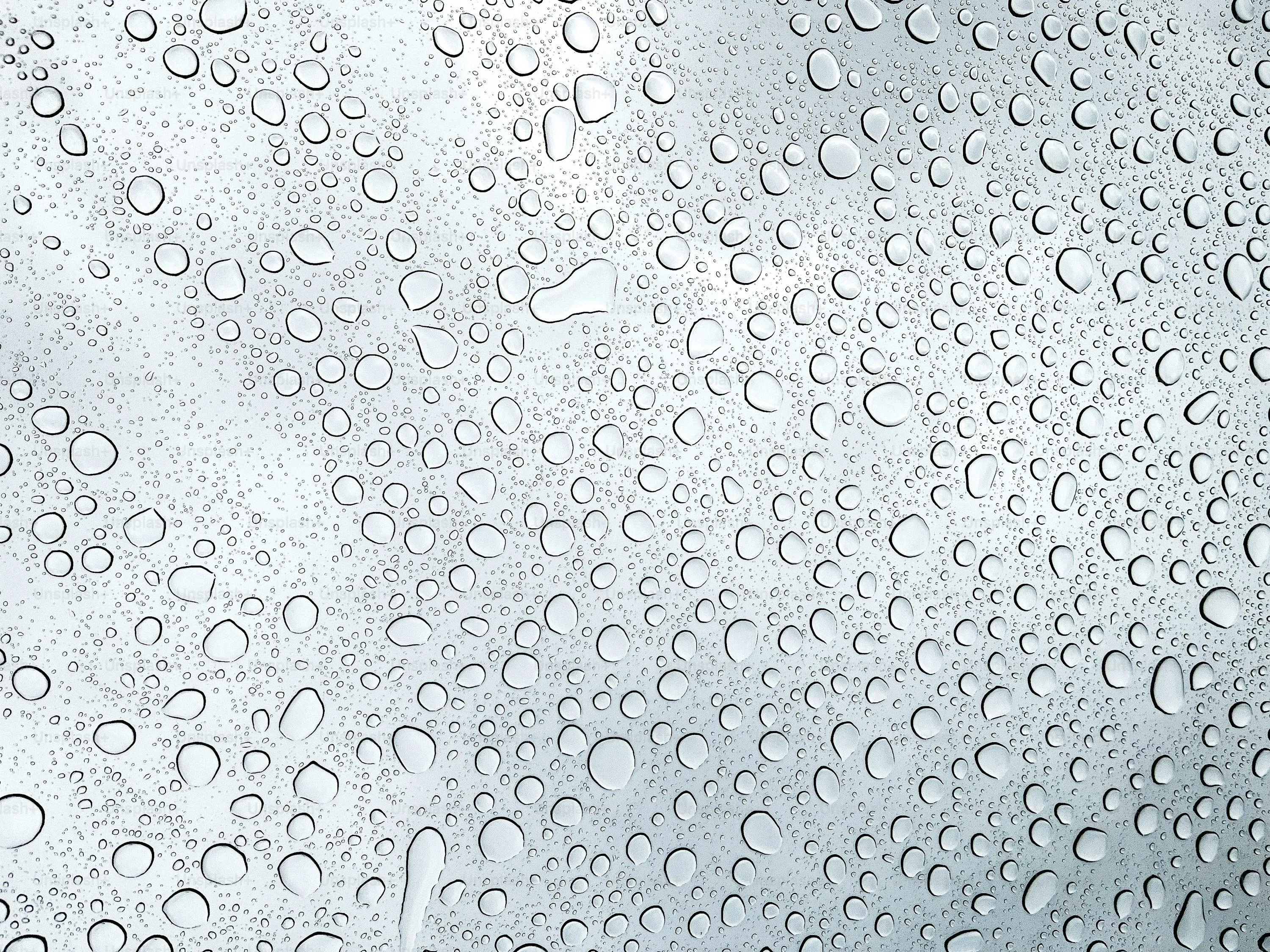 Window Covered in Dense Water Droplets From Rain Image