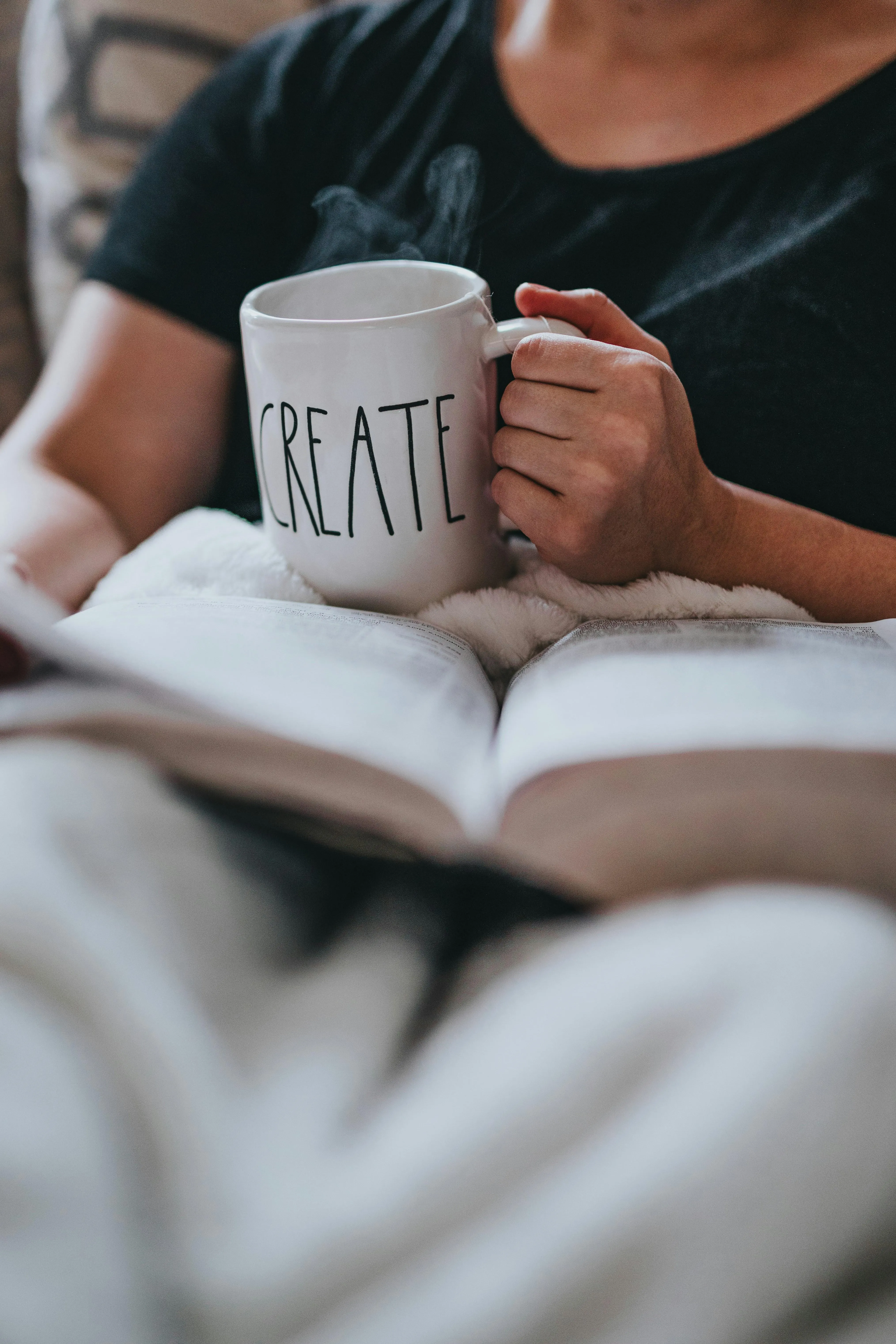 Woman Relaxing in Bed Holding Mug During Rainy Morning
