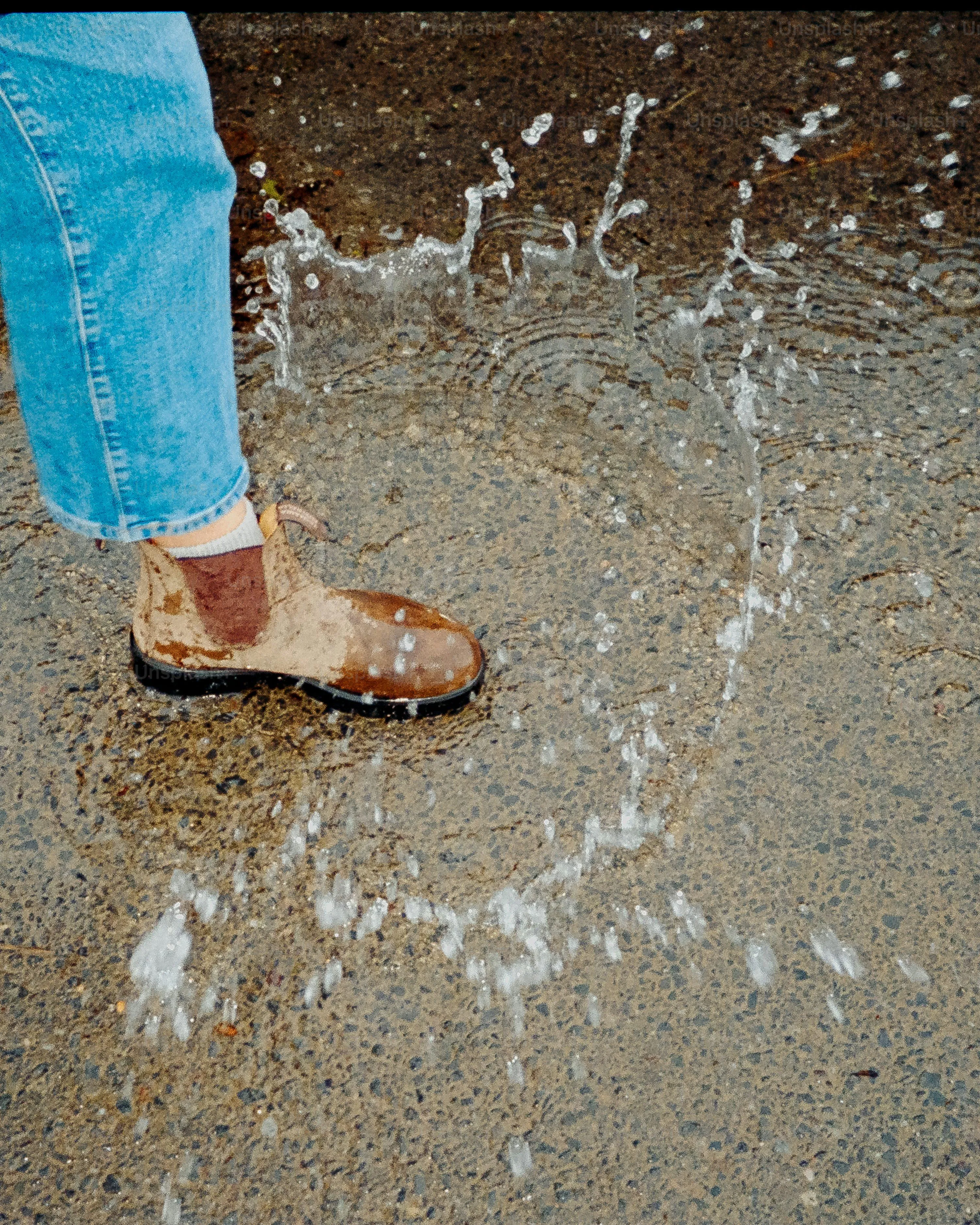 Woman Walking in Rain Wearing Blue Jeans and Shoes