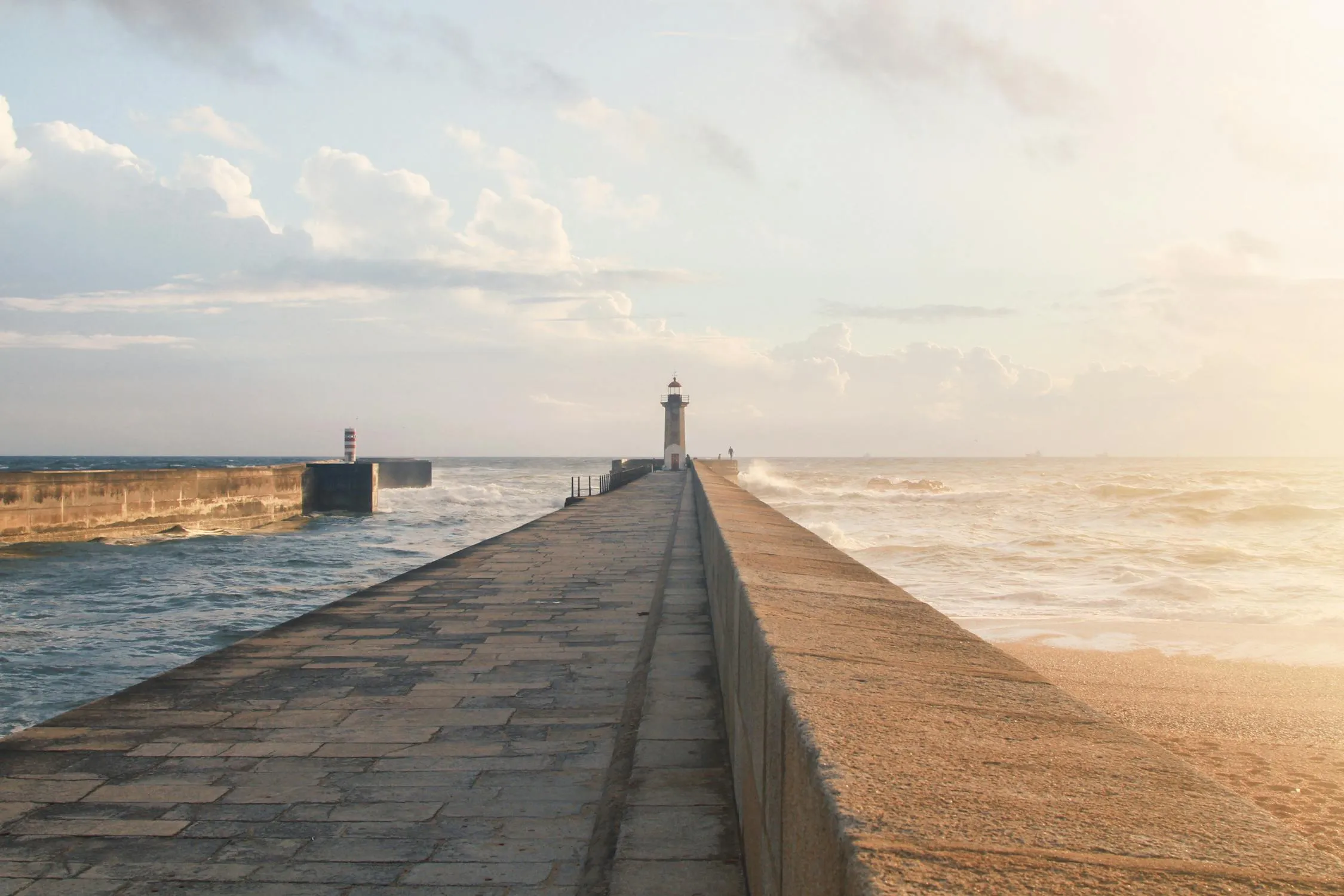 Wooden Pier Extending Into Calm Ocean at Sunrise HD Image