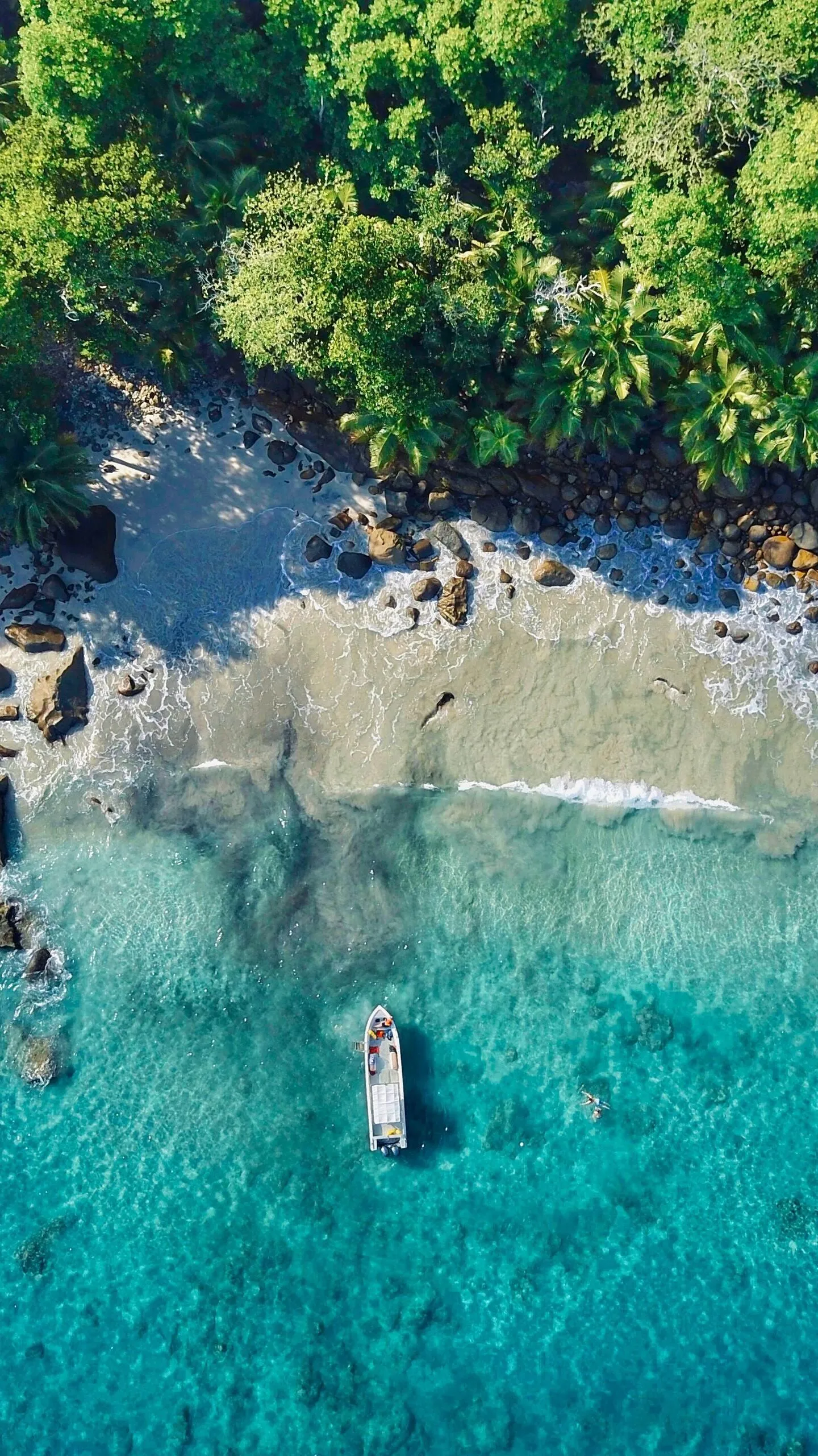 Aerial View of Crystal Clear Sea with a Single Boat