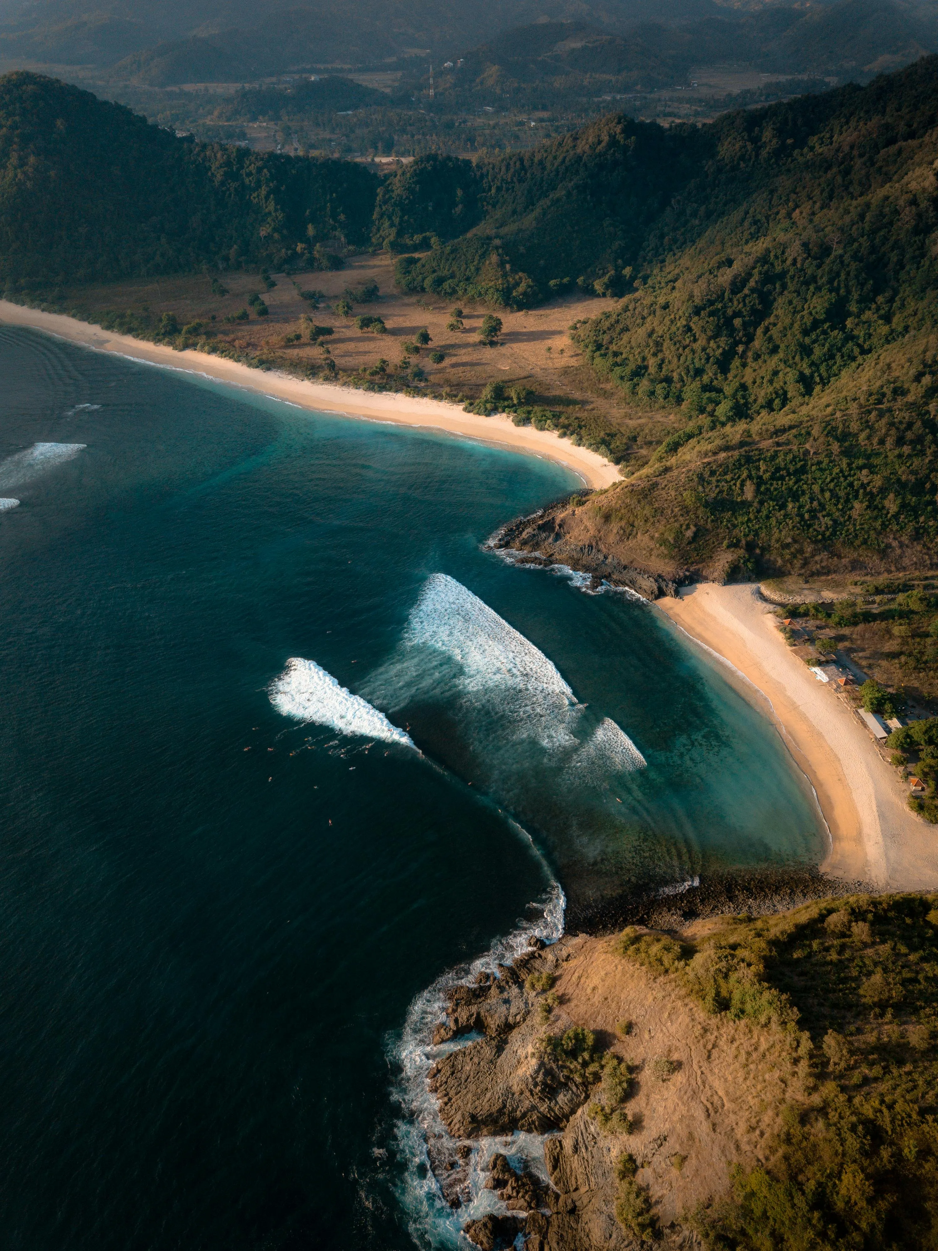 Aerial View of Dramatic Coastline with Deep Blue Waves