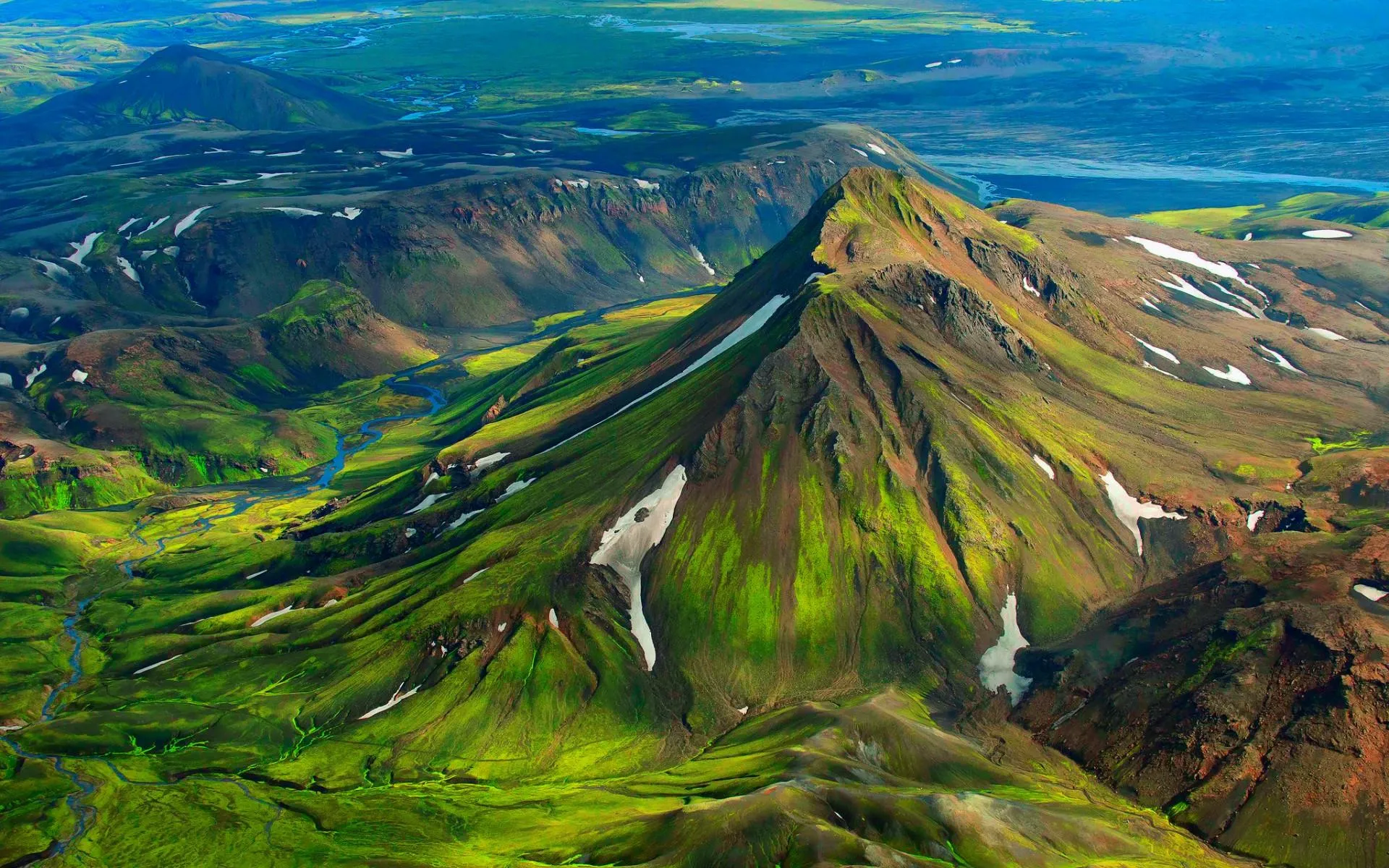 Aerial View of Green Volcanic Mountain with Blue Sky Above