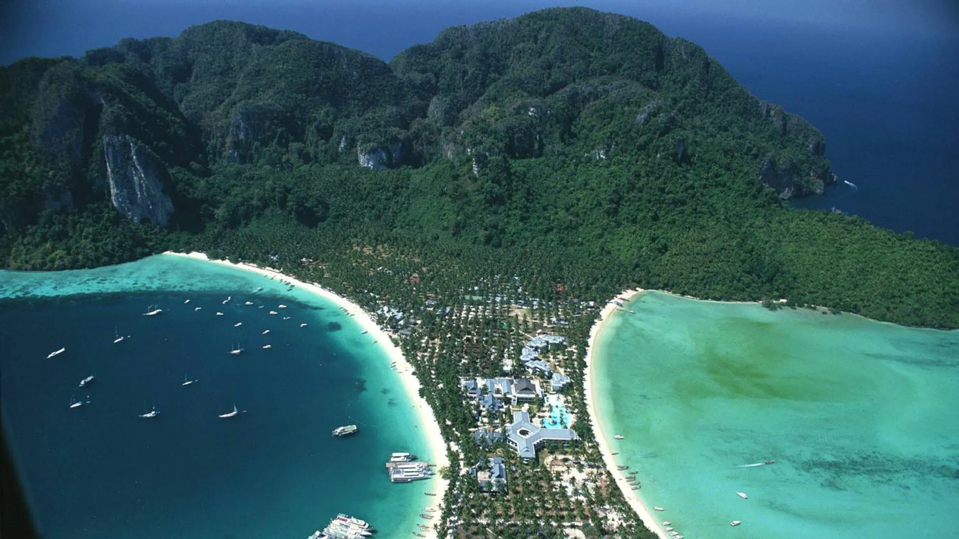 Aerial View of Tropical Coastline with a Mountain Wallpaper