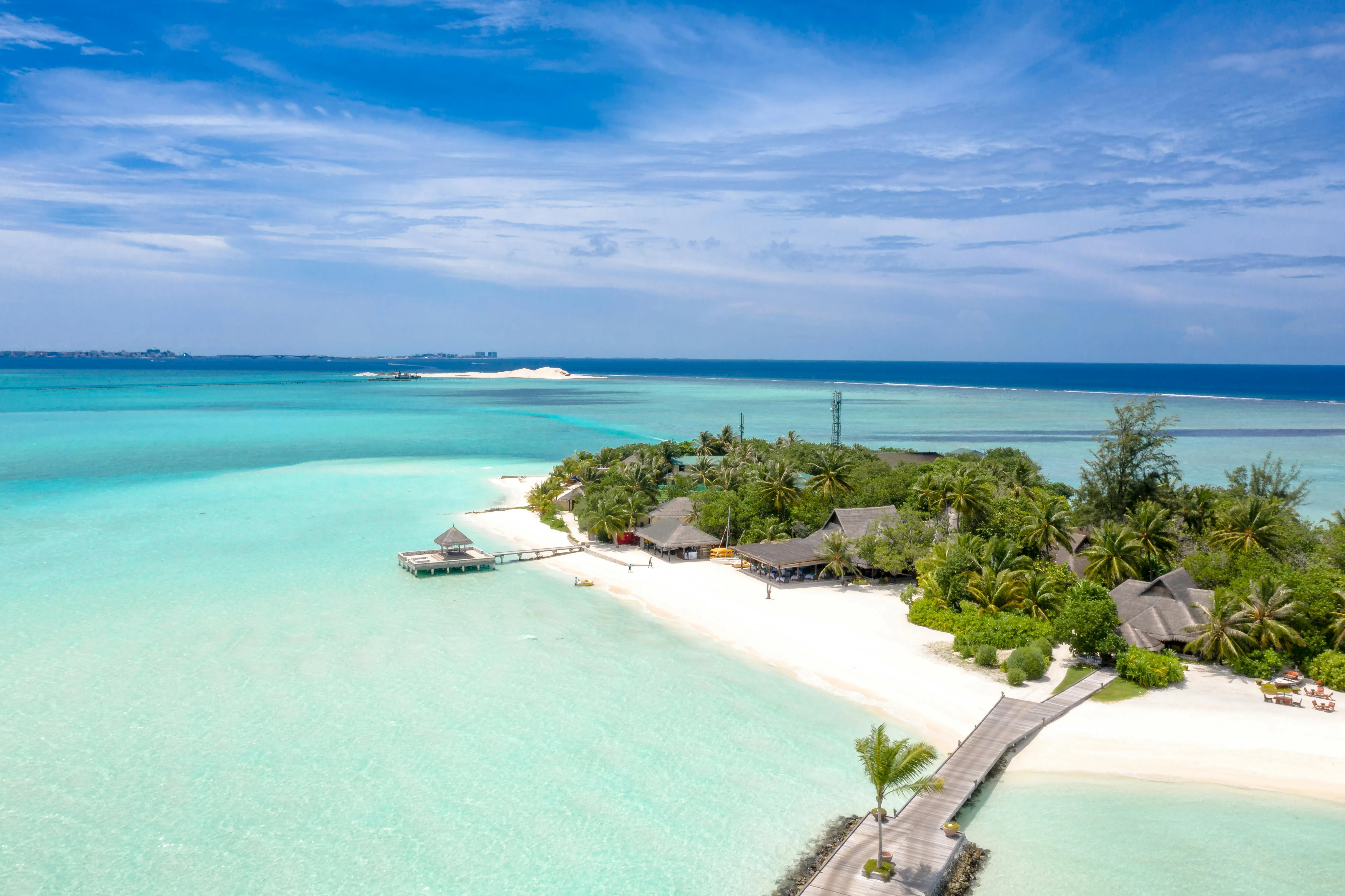 Aerial View of White Beach and Overwater Tropical Huts