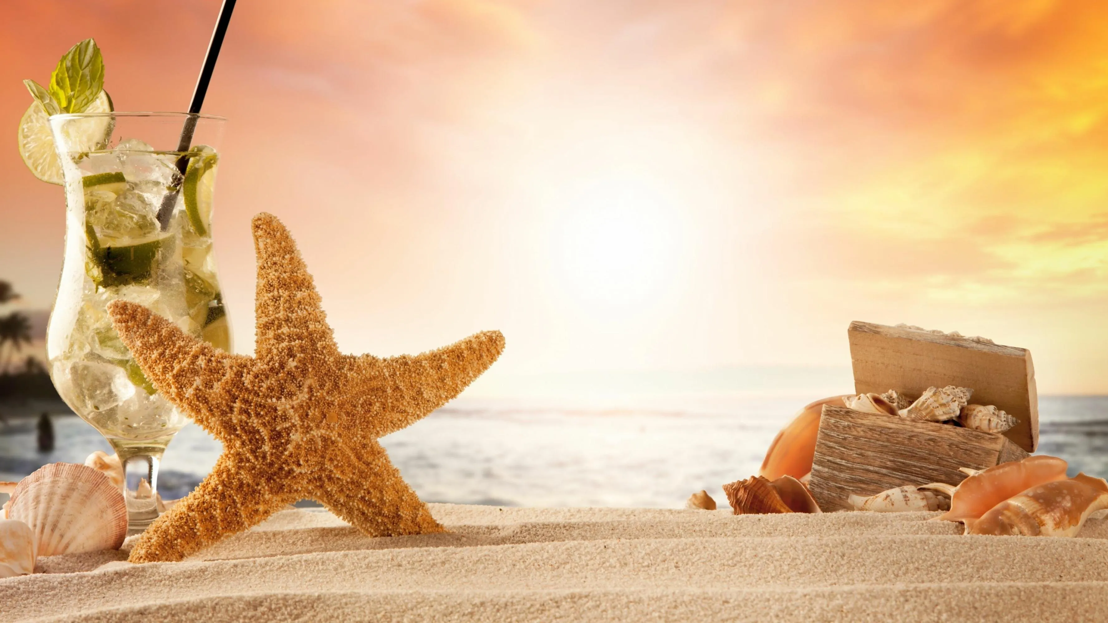 Beach Decor with Starfish and Drink at Summer Sunset