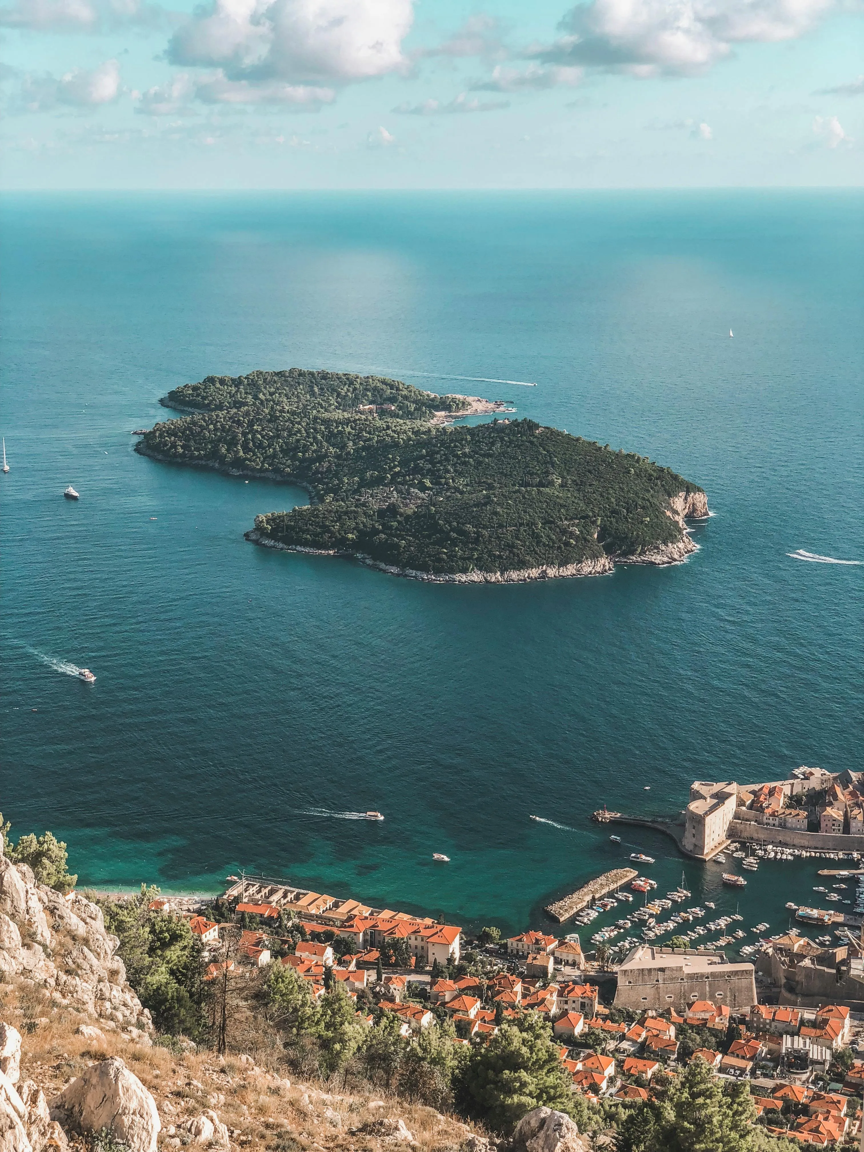 Beautiful Island with Boats and a Town Portrait Wallpaper