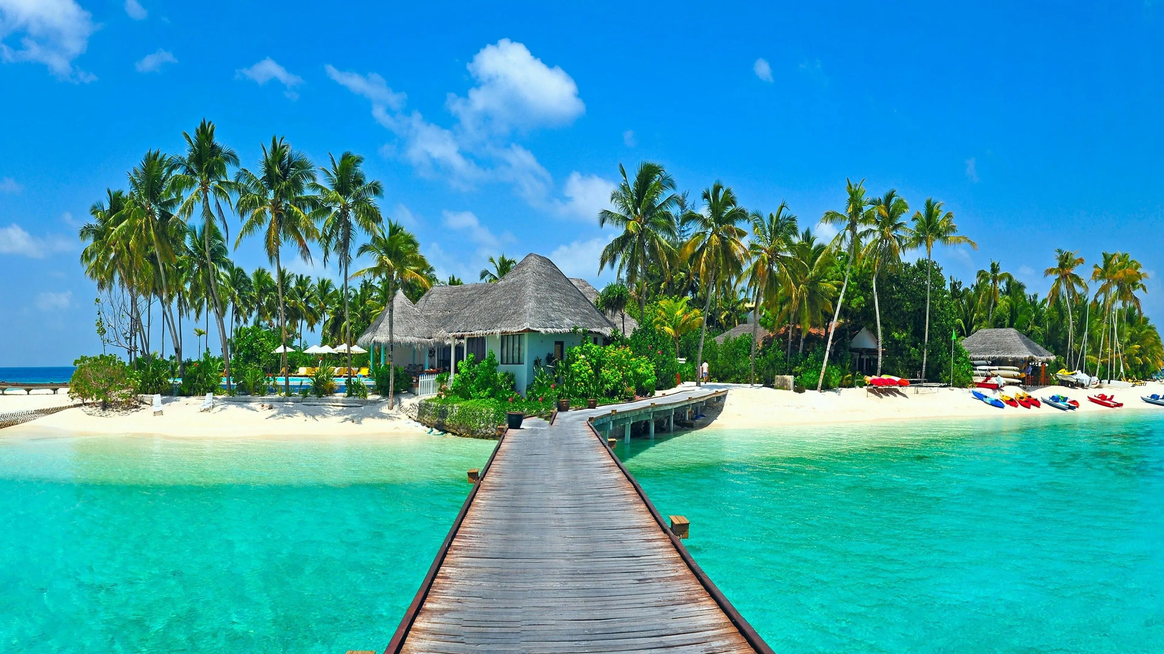 Boardwalk Leading to Beach Villa over Crystal Clear Water