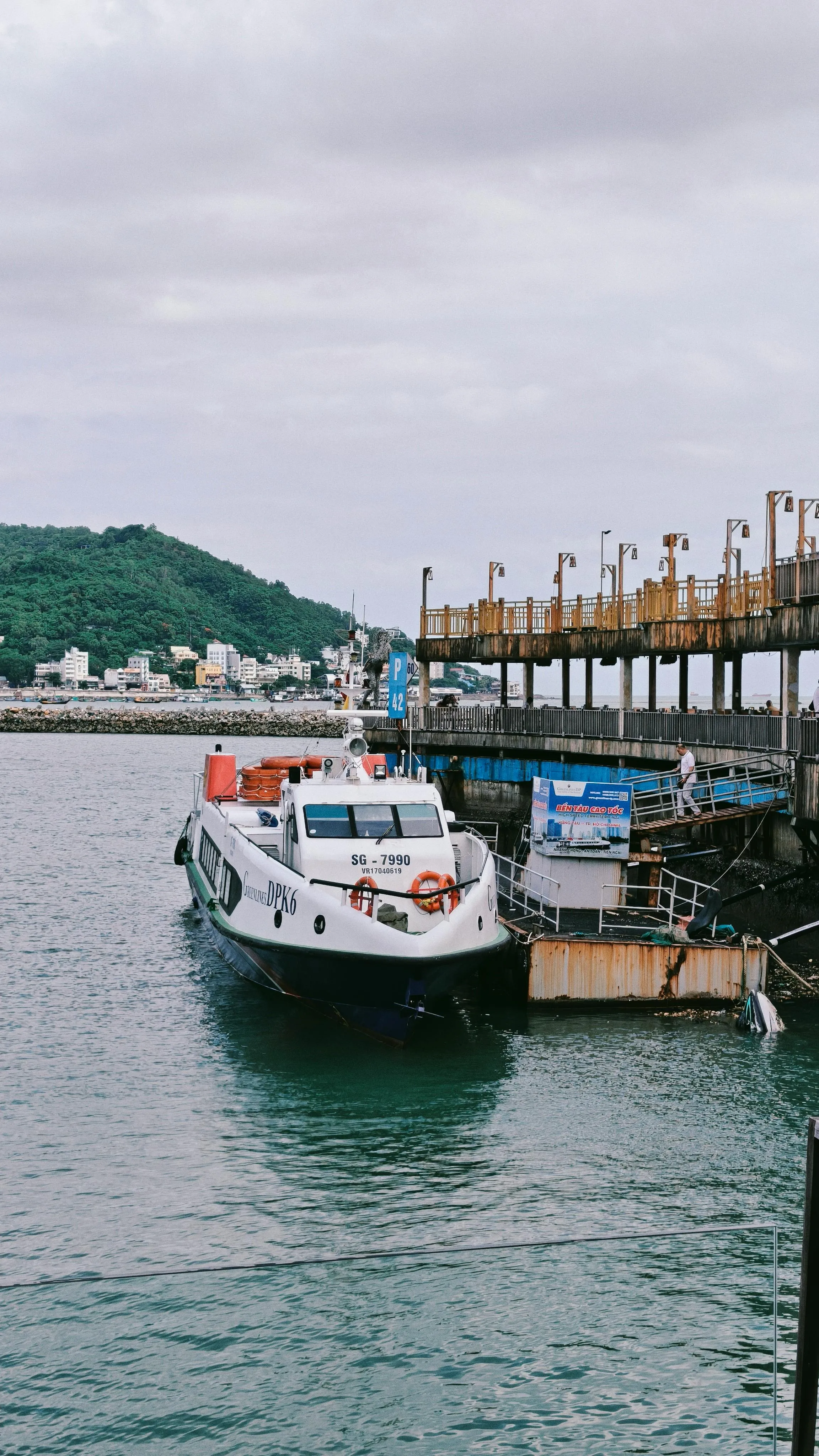 Boats are Anchored at a Peaceful Tropical Beach Wallpaper