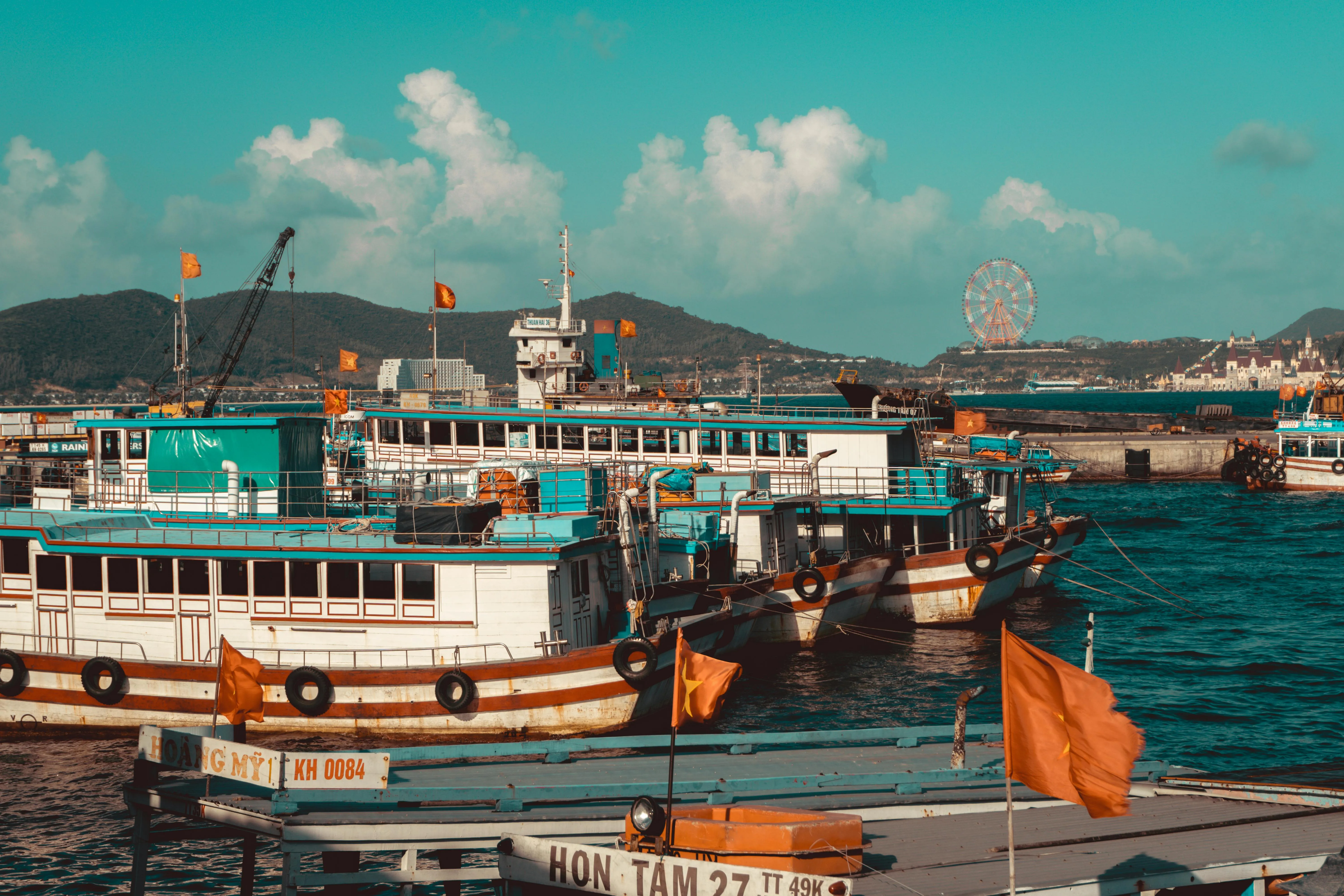 Boats Docked in a Busy Harbor on a Clear Sunny Day Wallpaper