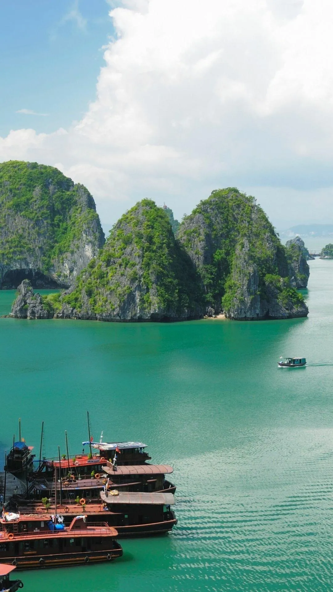 Boats Docked by a Stunning Bay with Limestone Cliffs