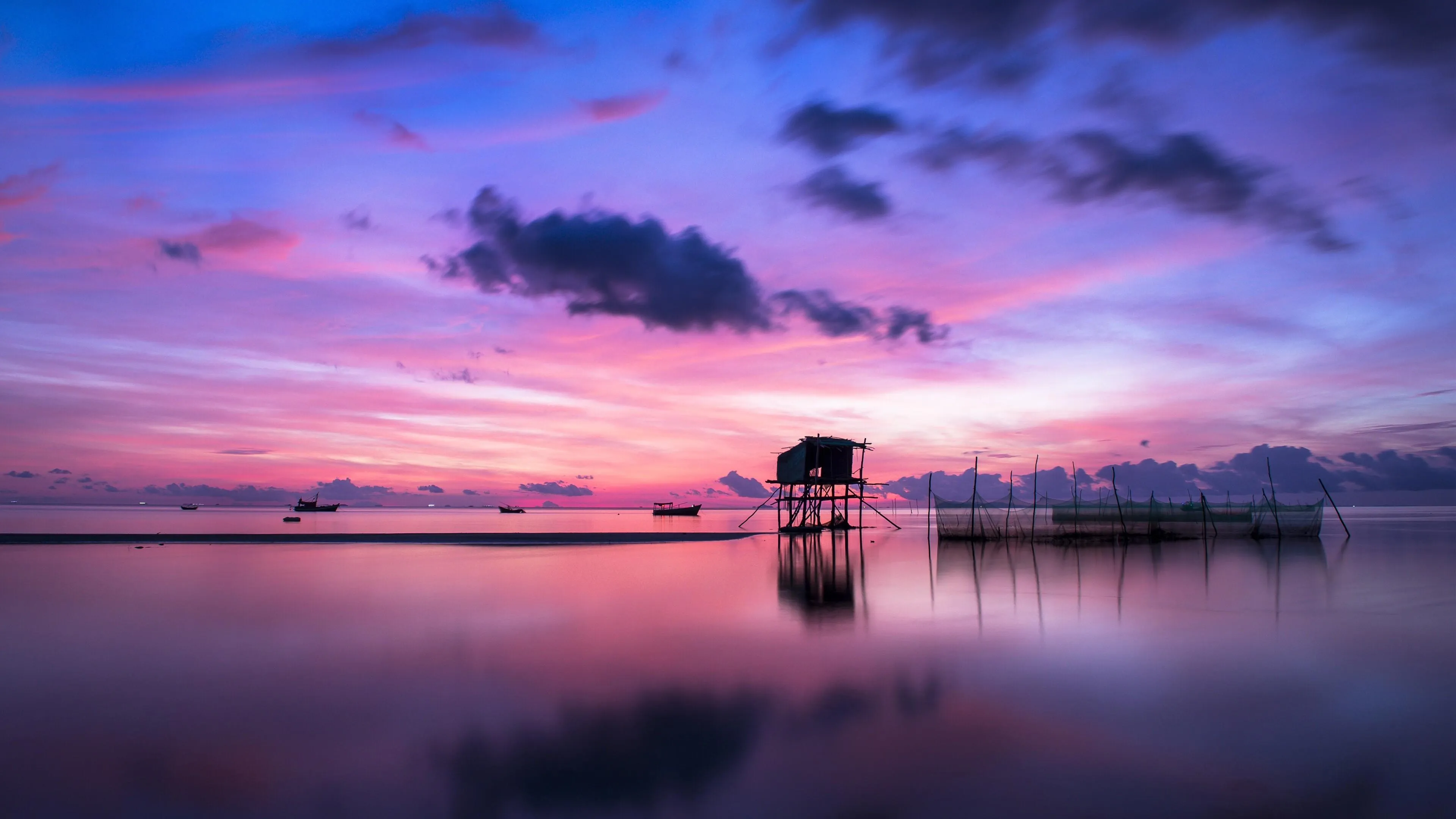 Calm Ocean Reflecting Purple Colors of a Stunning Sunset