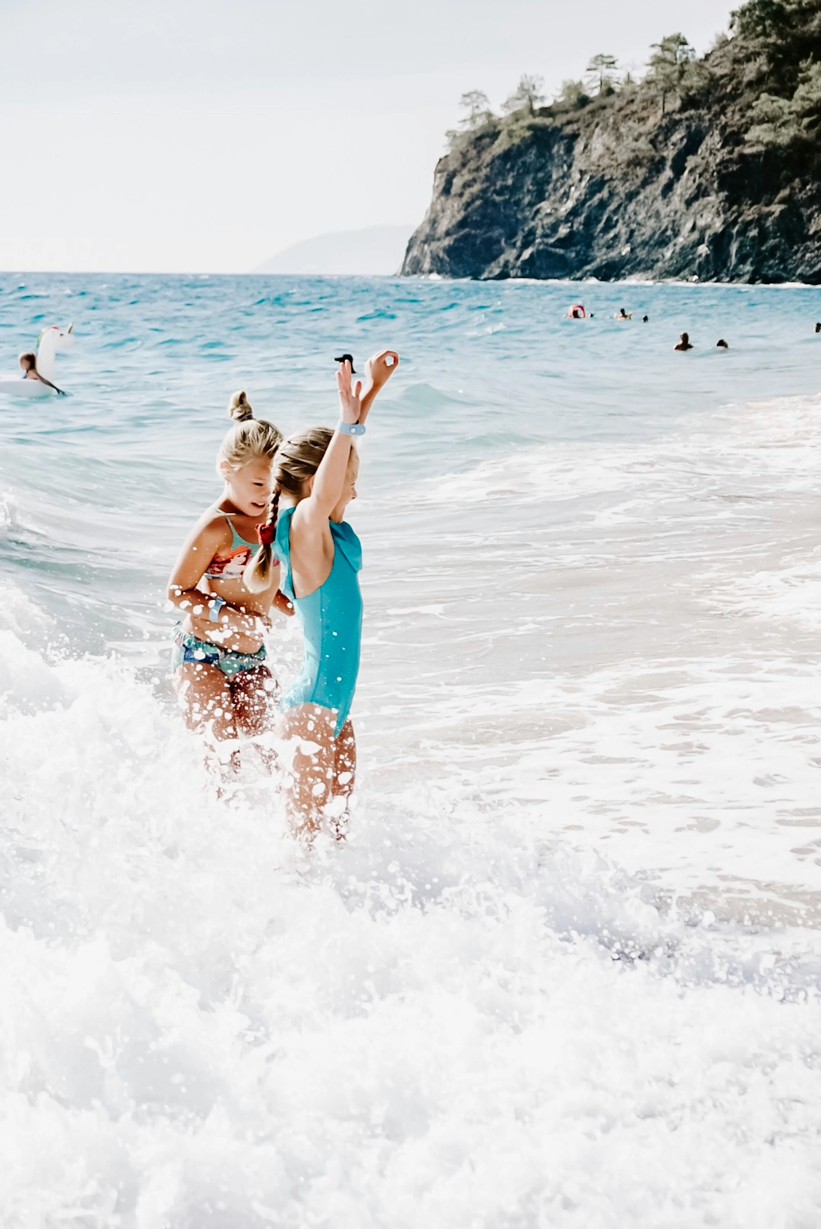 Child Playing in Waves on the Beach Download Free Wallpaper