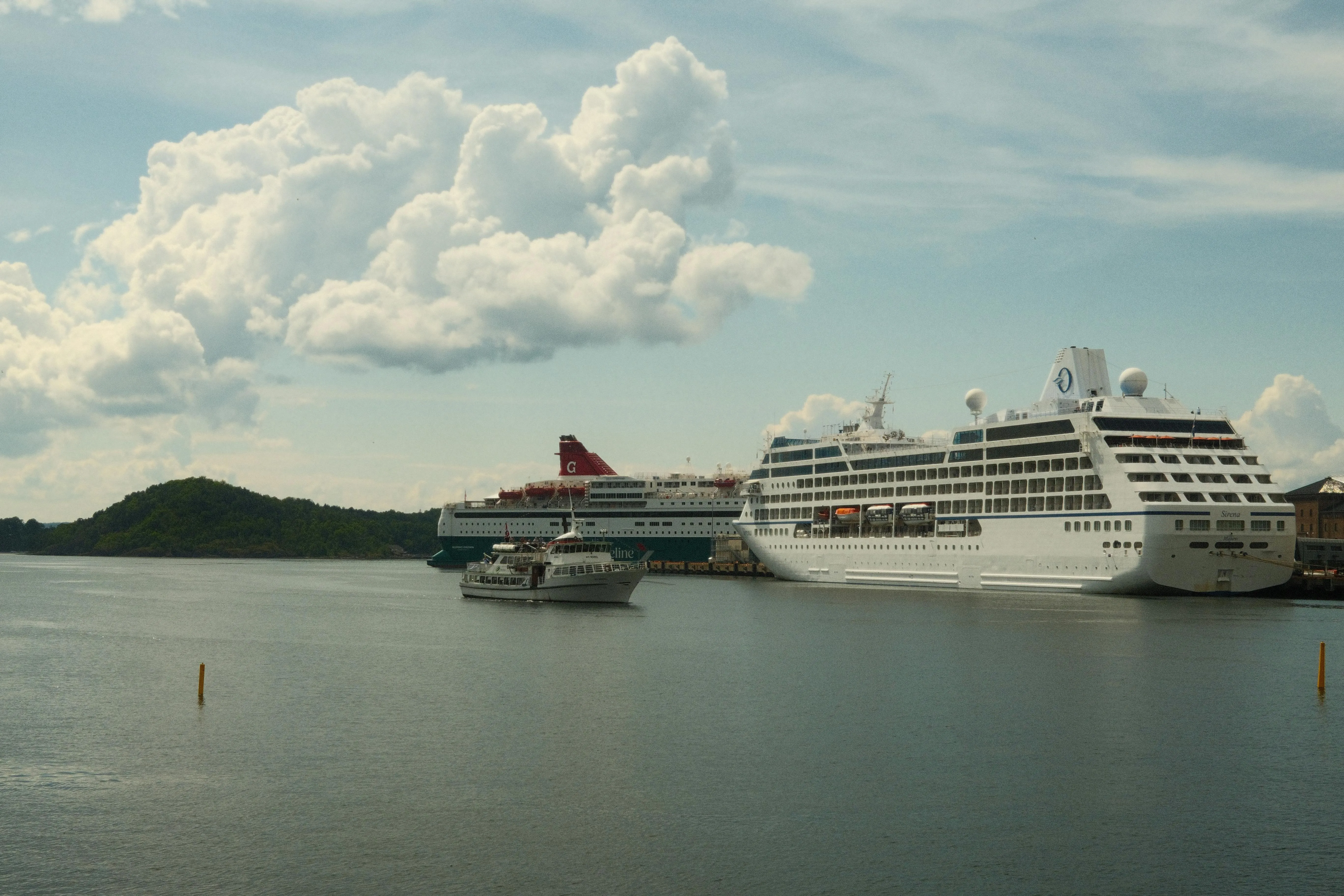 Cruise Ship Docked Near Green Islands Landscape Wallpaper