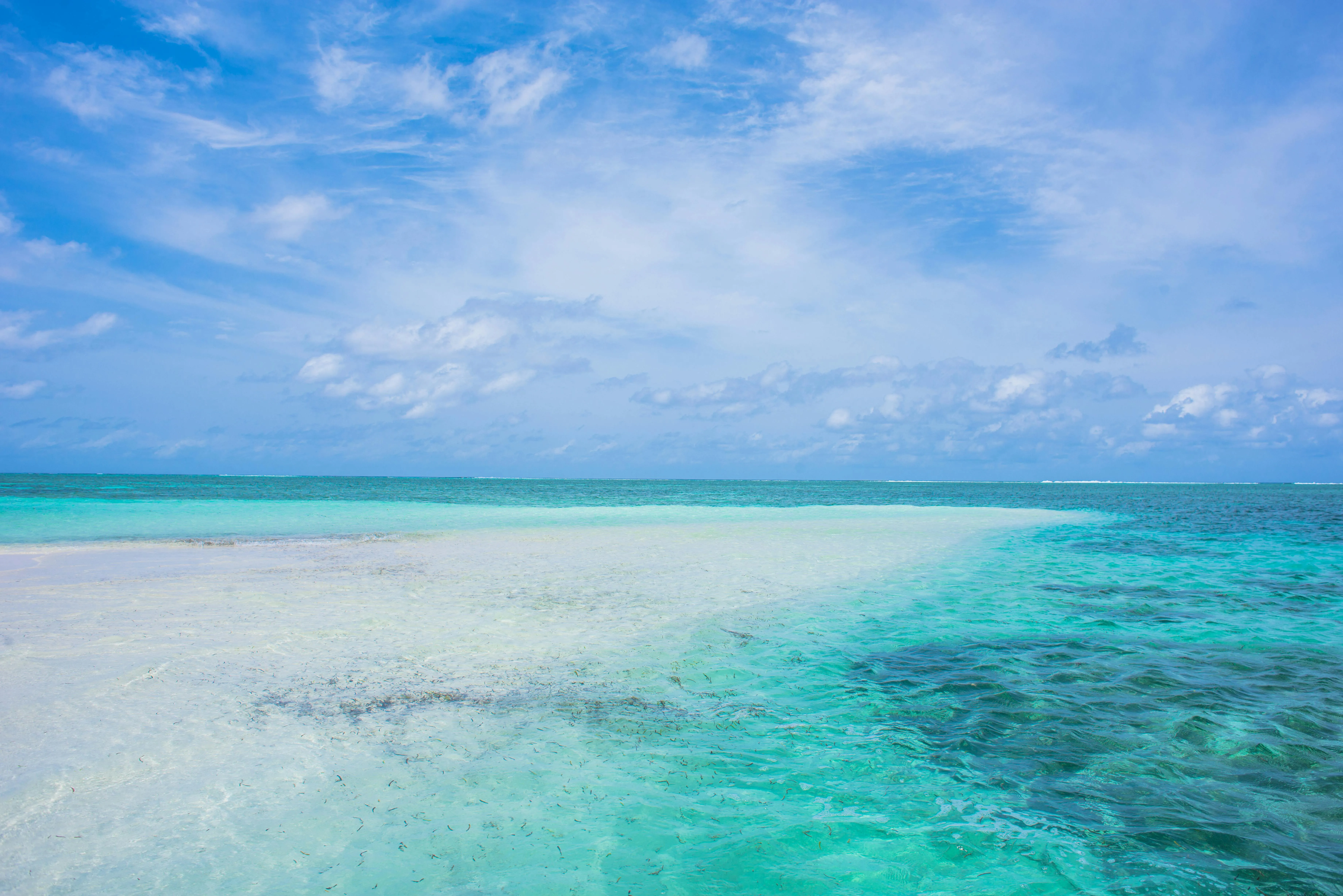 Crystal Clear Turquoise Water and White Sandy Ocean Beach