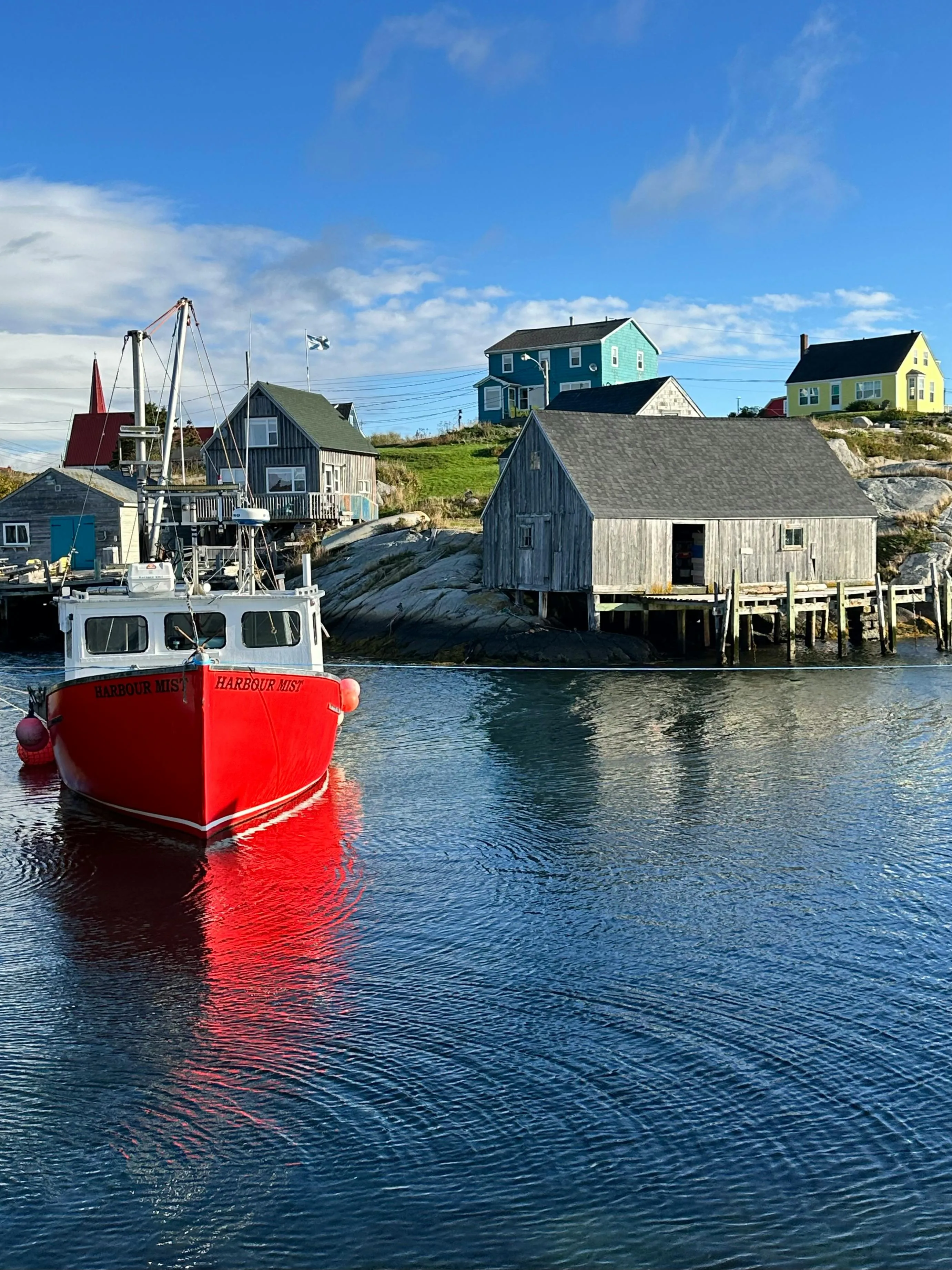 Fishing Boats in the Calm Harbor by Colorful Seaside Homes