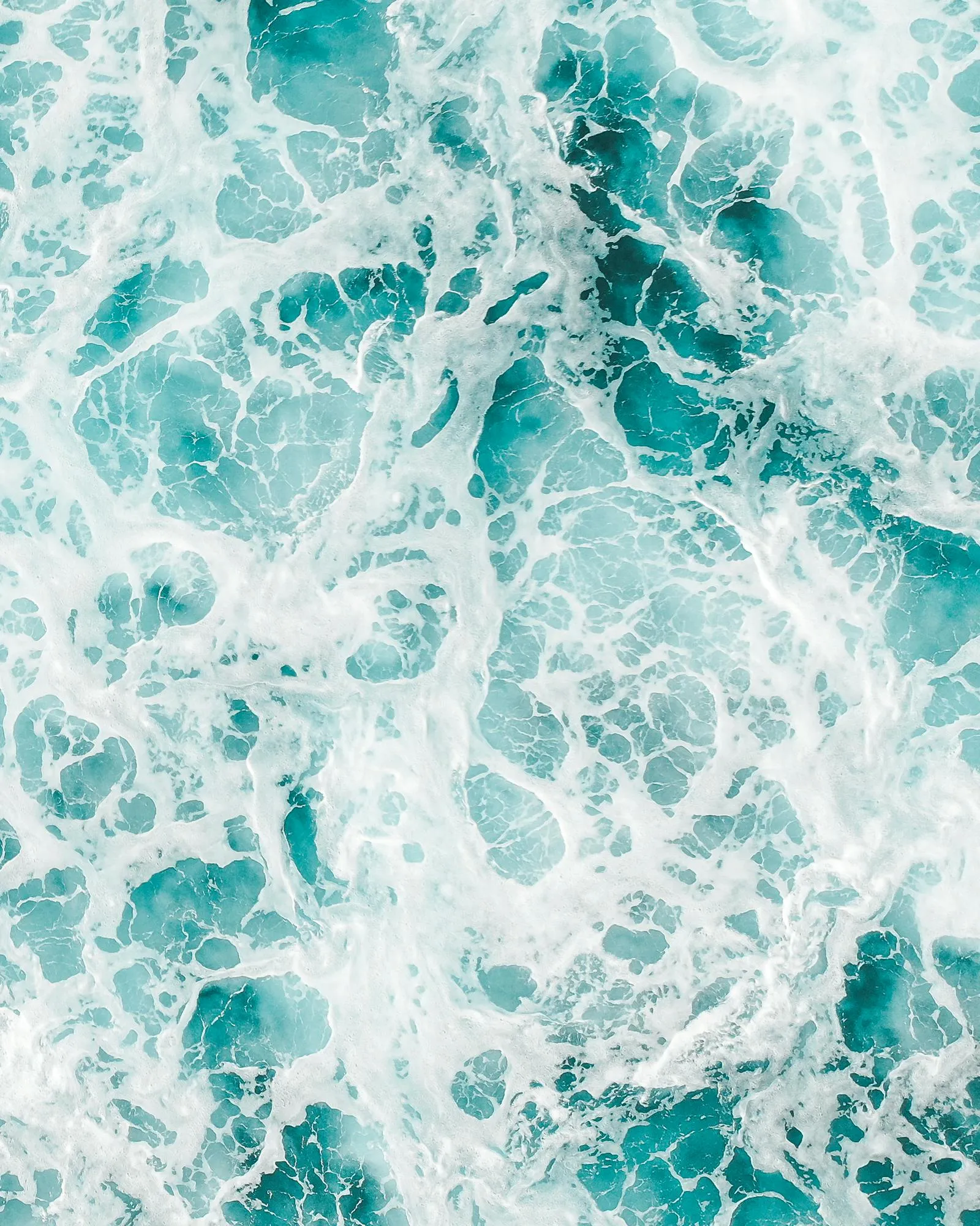 Foamy Ocean Waves Captured from Above the Sea Free Wallpaper