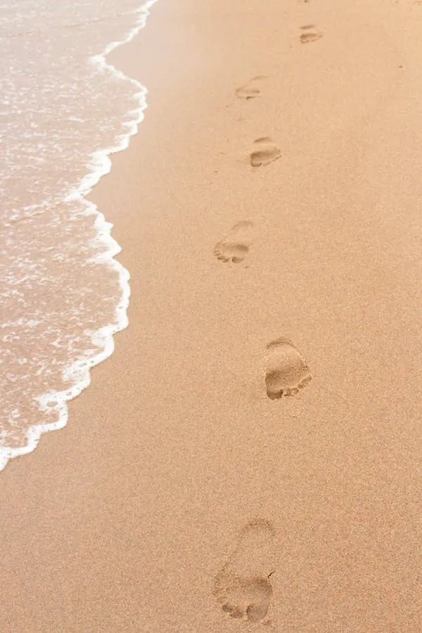 Footprints in Wet Sand Beside the Ocean Waves HD Wallpaper