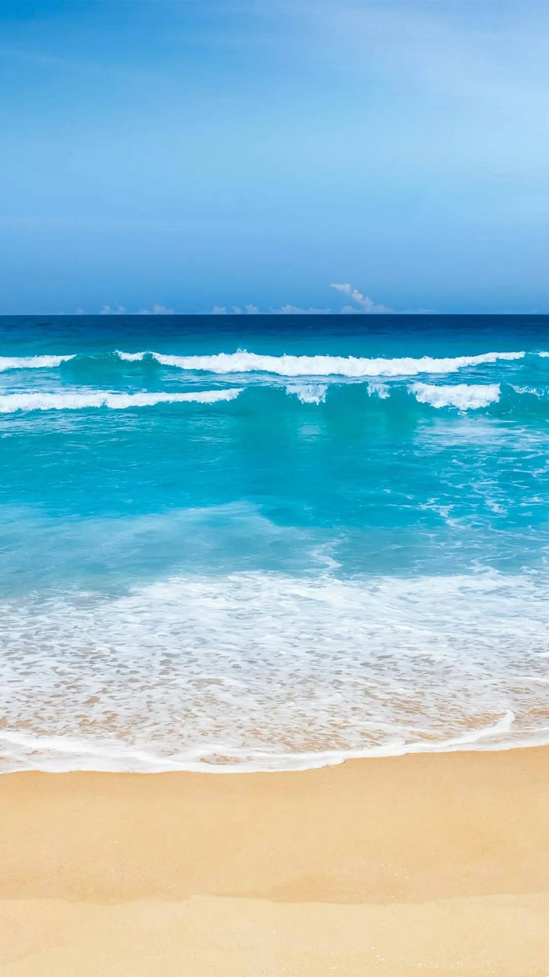 Gentle Waves over a Golden Sandy Beach Shore Wallpaper