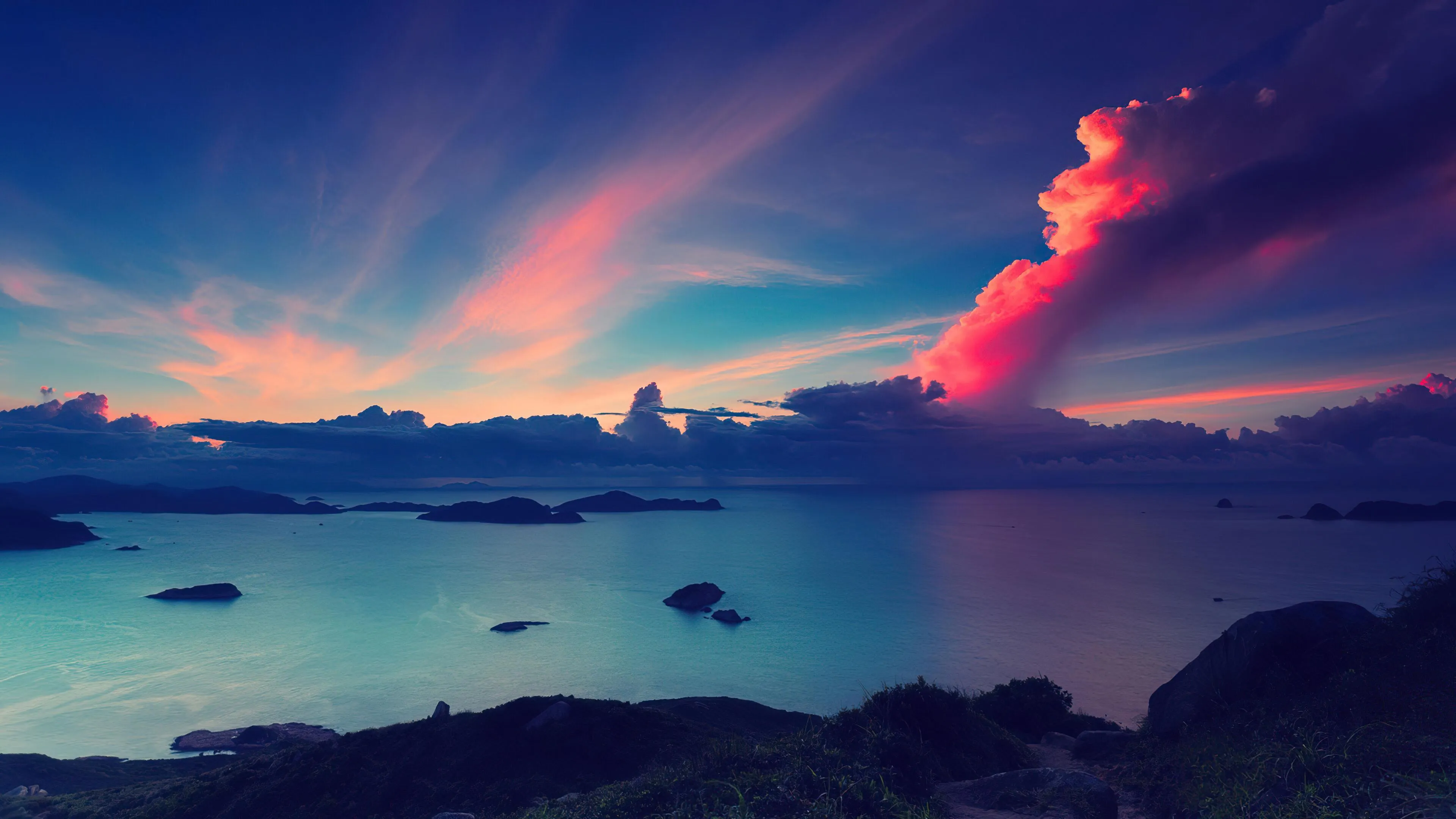 Glowing Sunset Sky over Islands in a Calm Blue Sea