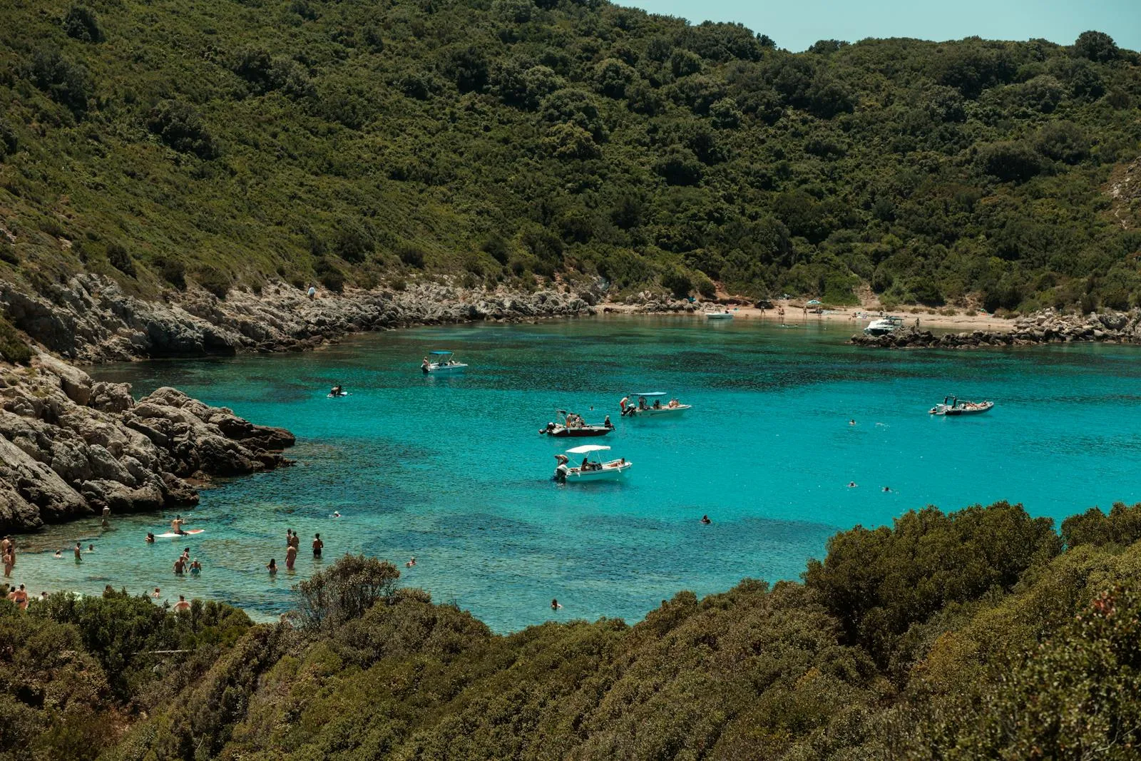 Hidden Cove with Turquoise Water and Anchored Small Boats