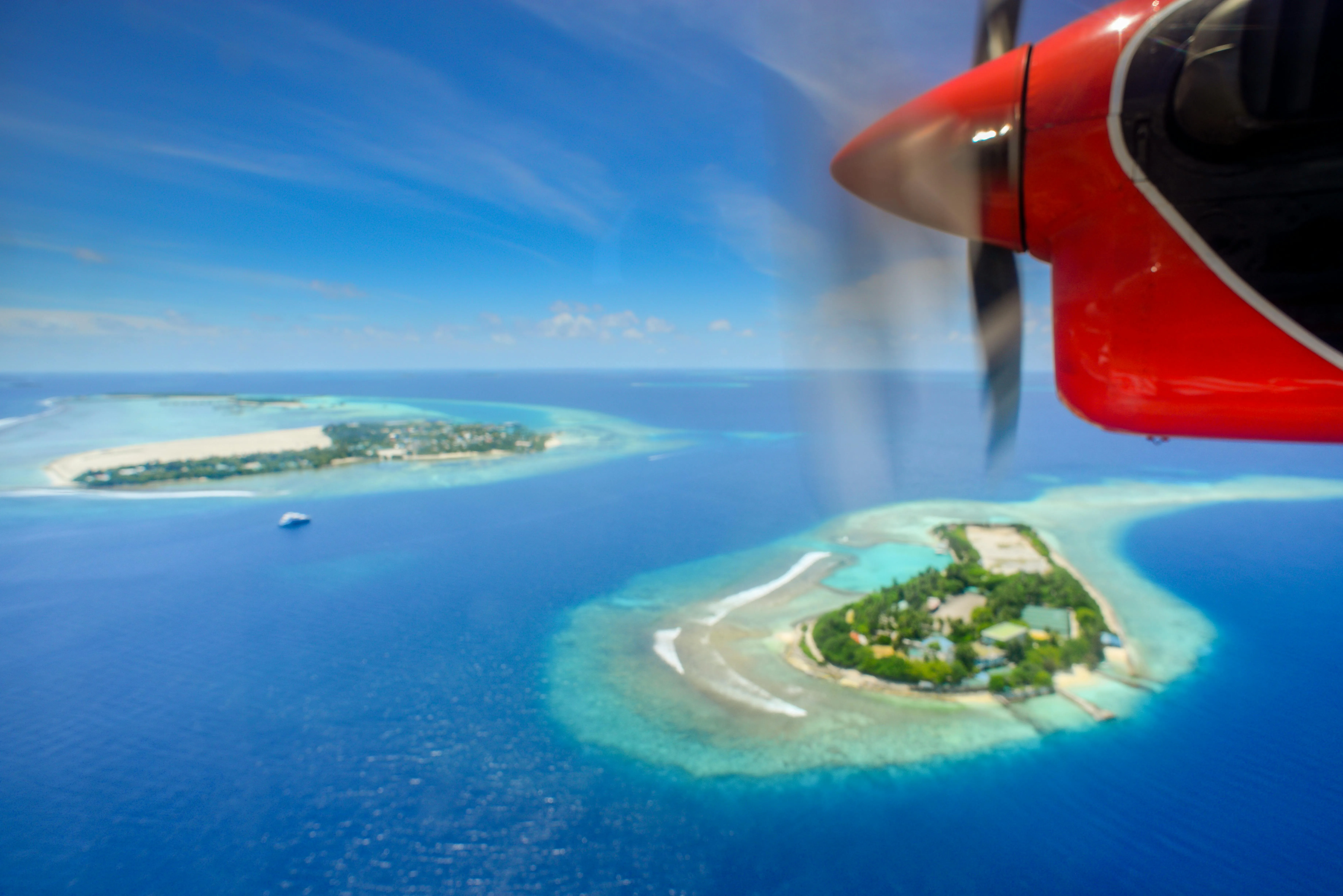 Island Aerial View Captured from a Red Airplane Window