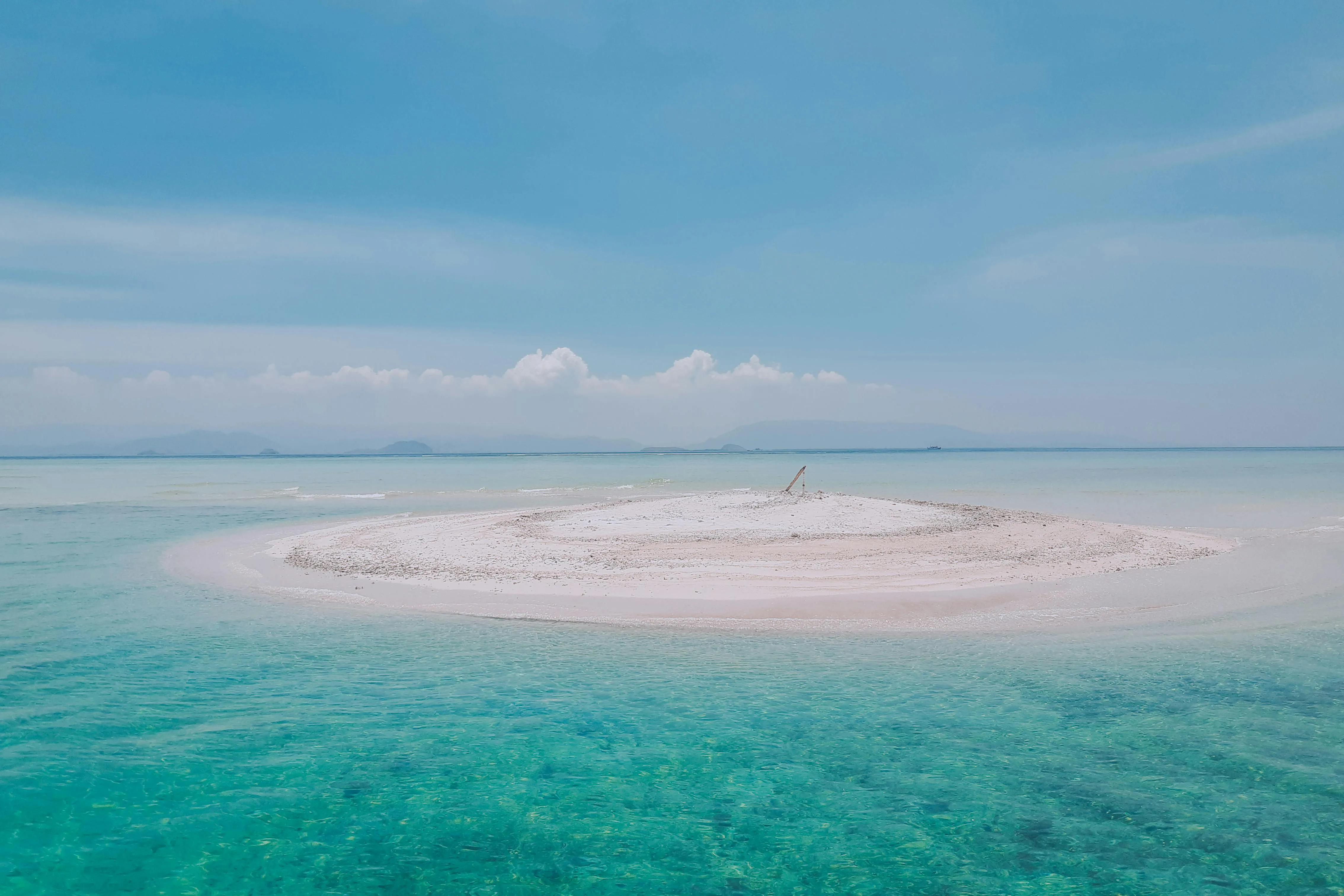 Isolated White Sandbar in the Middle of a Blue Ocean