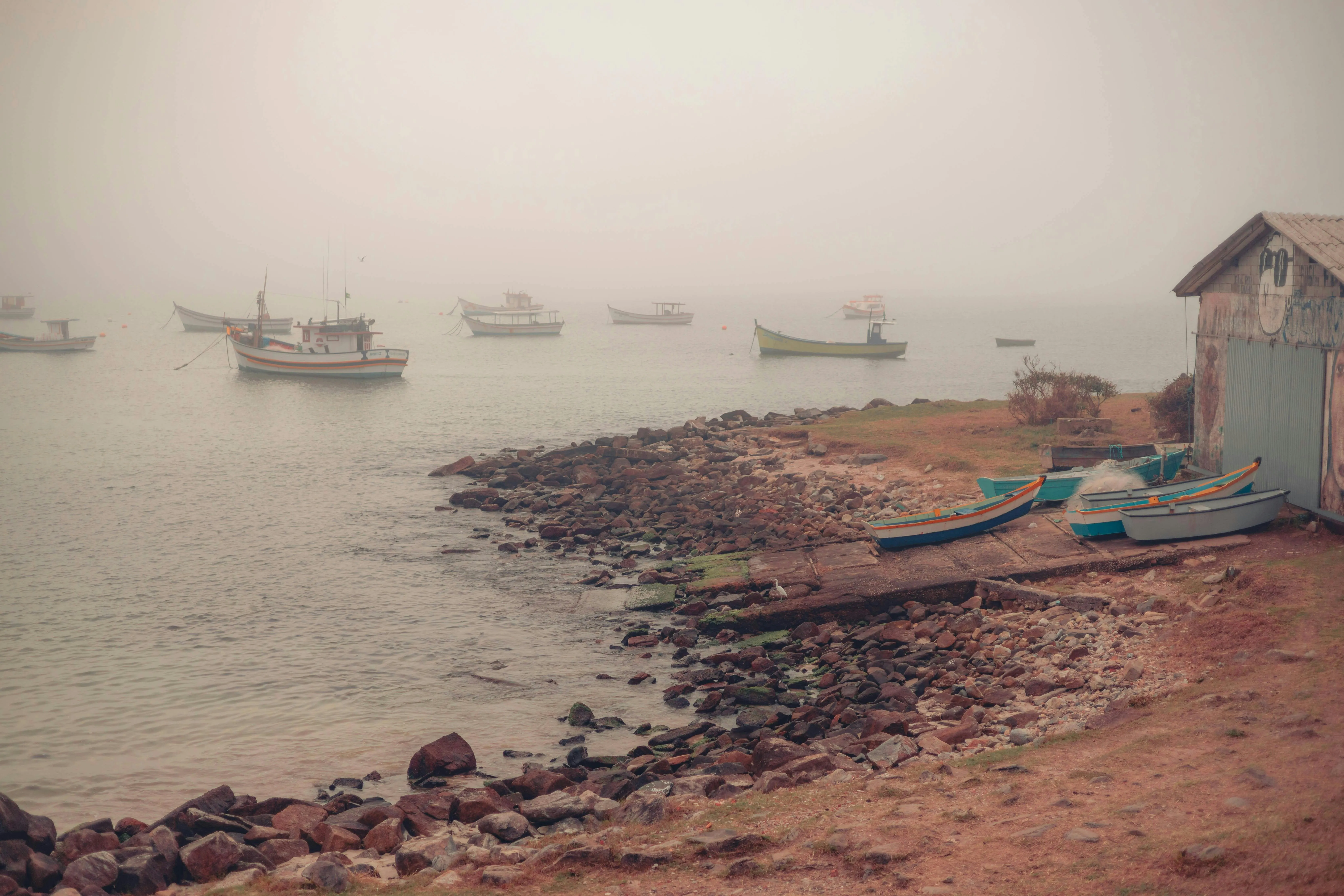 Misty Fishing Village Morning Along a Quiet Coast Wallpaper
