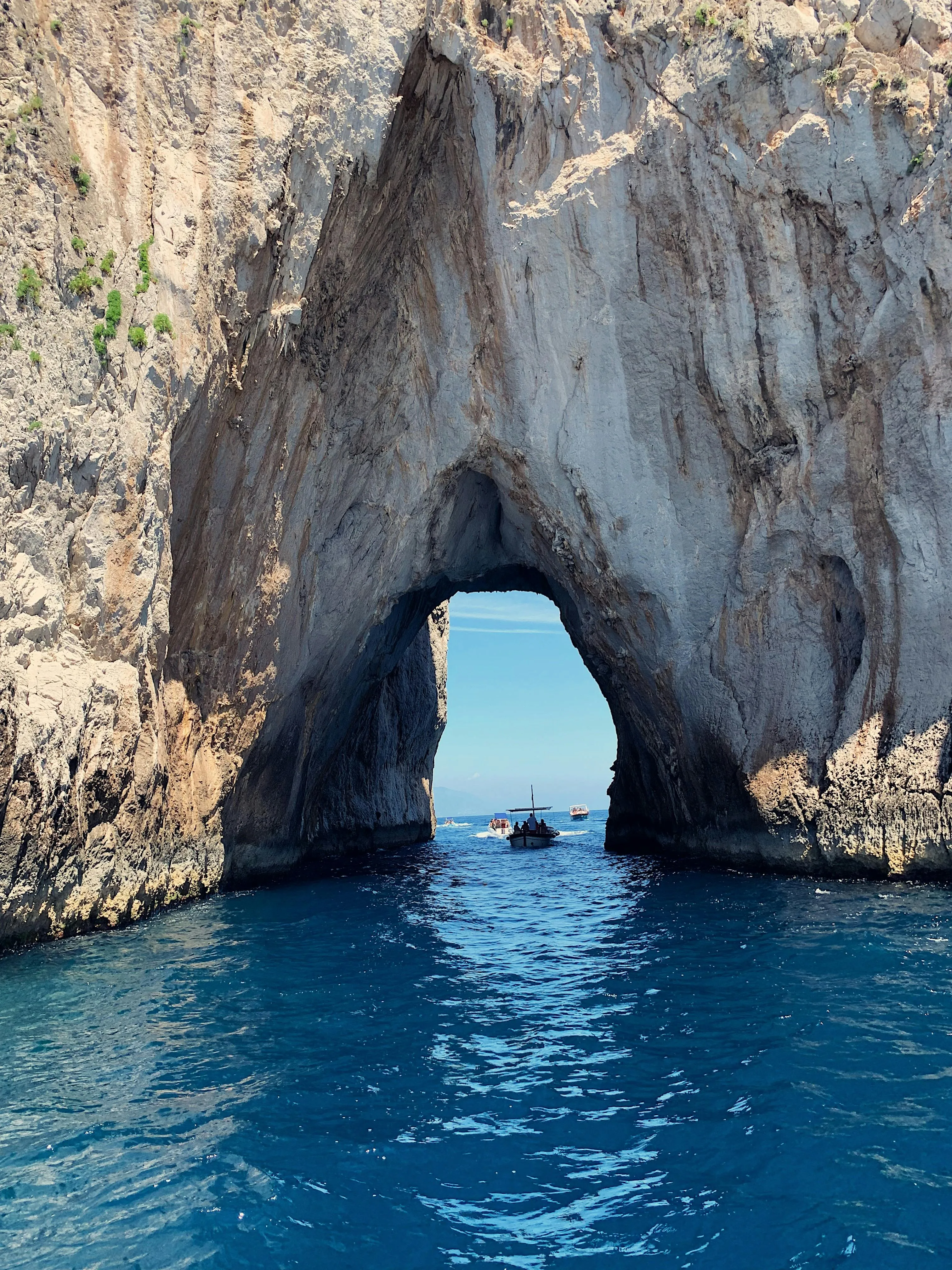 Natural Rock Archway Rising from the Ocean Free Wallpaper