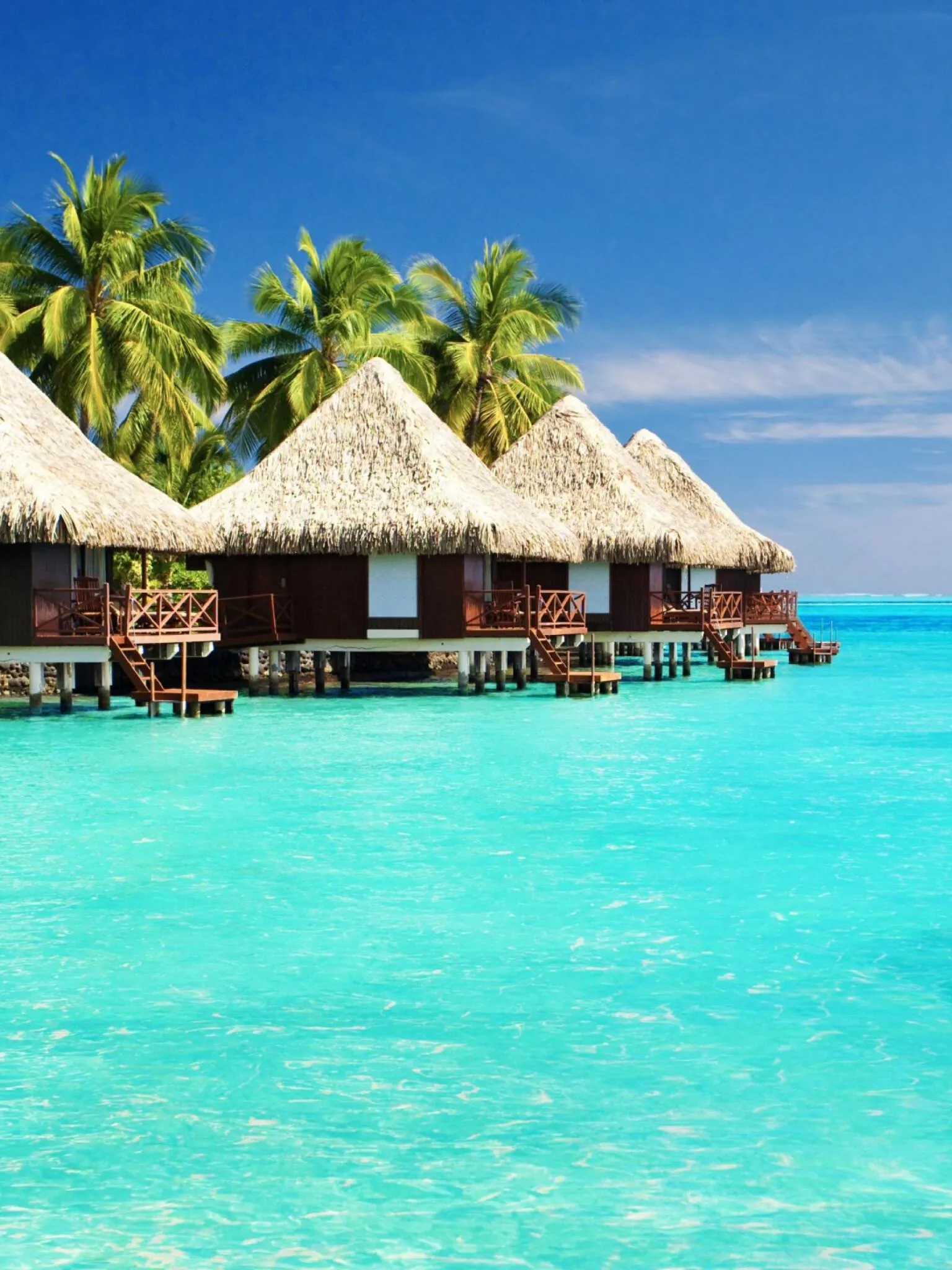 Overwater Bungalows with Bright Turquoise Lagoon Wallpaper