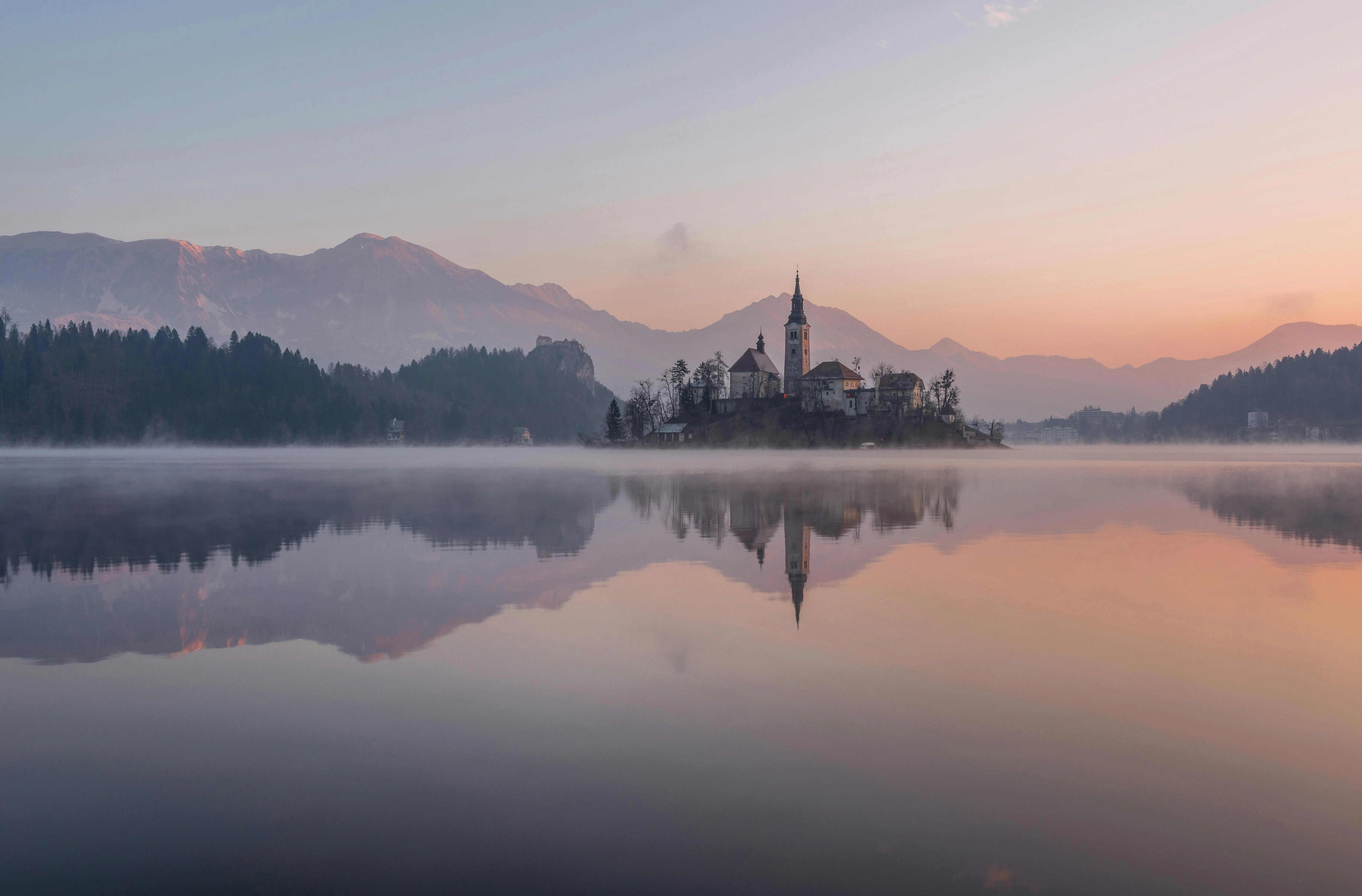 Peaceful Lake Island Reflection at Sunrise with Calm Waters