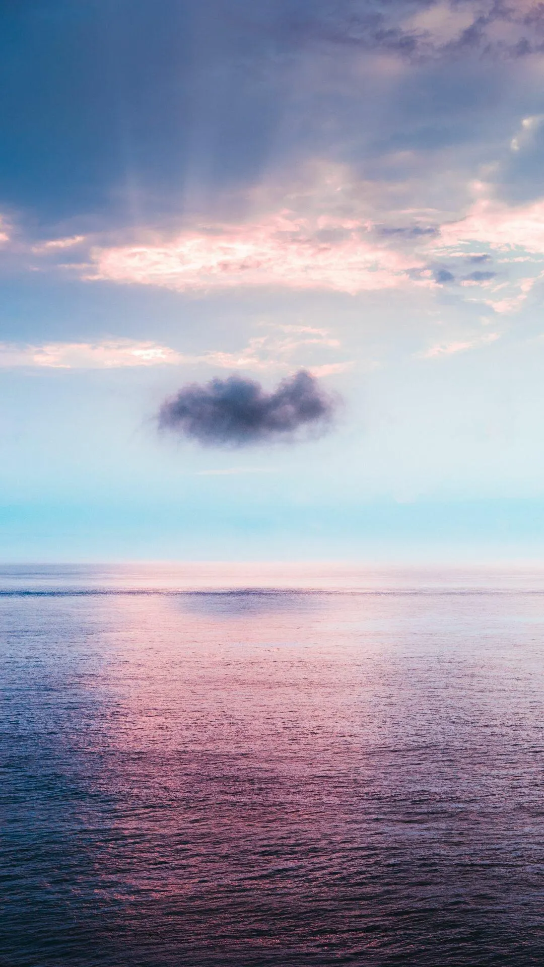 Peaceful Ocean Under a Purple Sunset Portrait Wallpaper