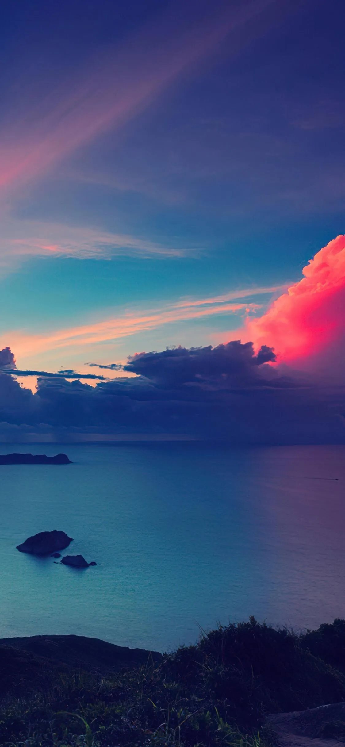 Purple Sunset over Calm Ocean with Soft Glowing Clouds