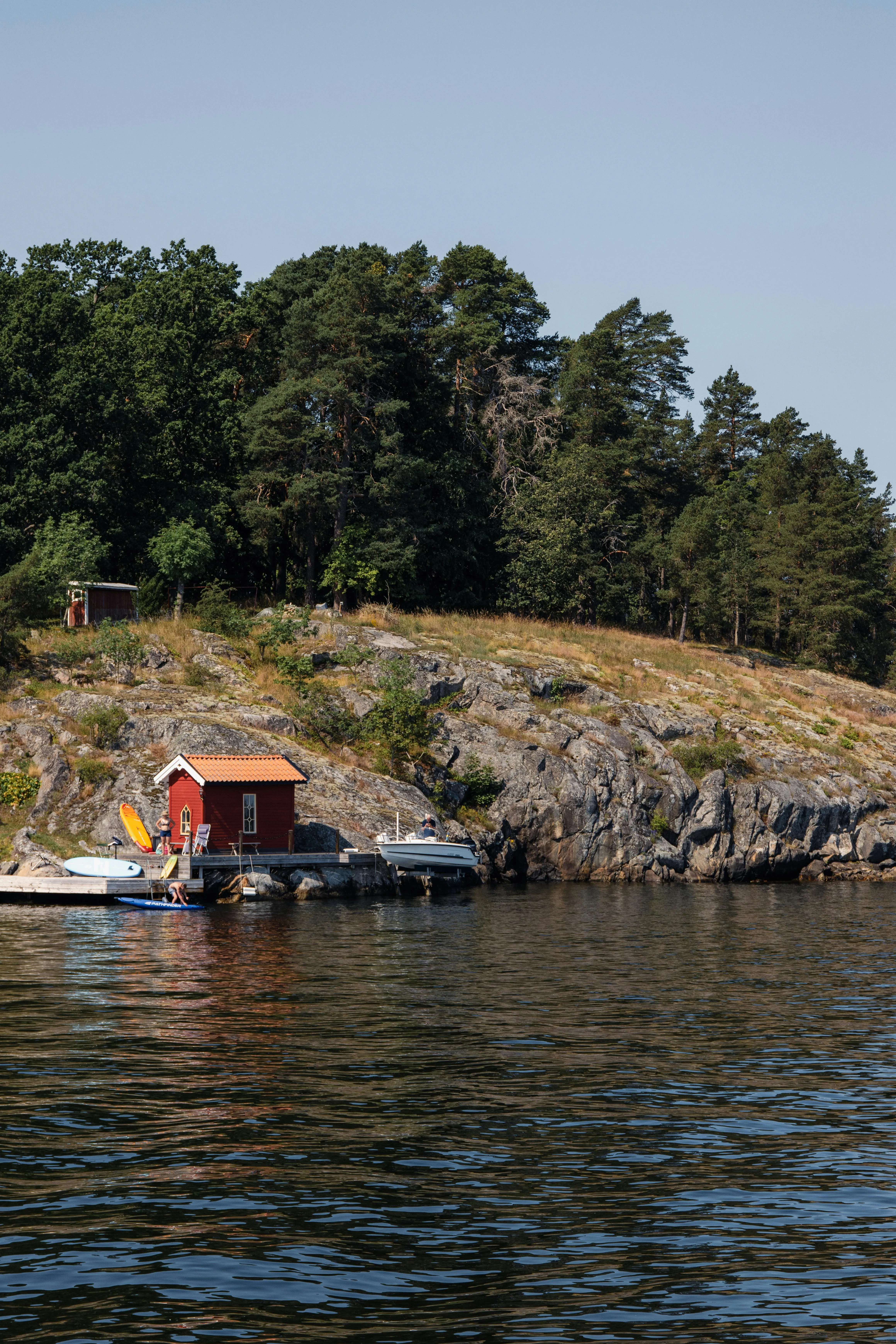 Red Cabin on the Lakeside Near Green Forest Free Wallpaper