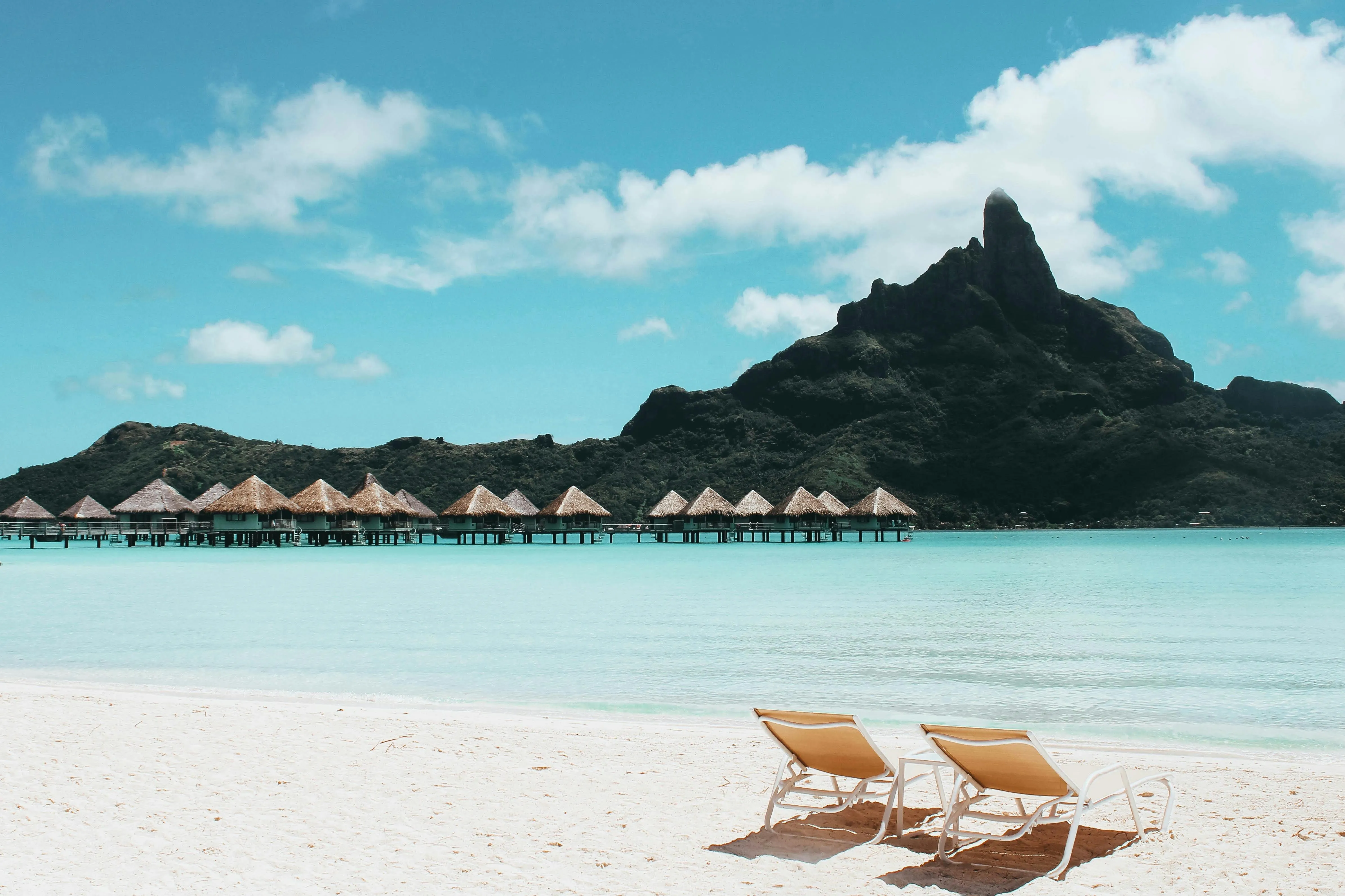 Relaxing Beach with Chairs and a Mountain HD Free Wallpaper