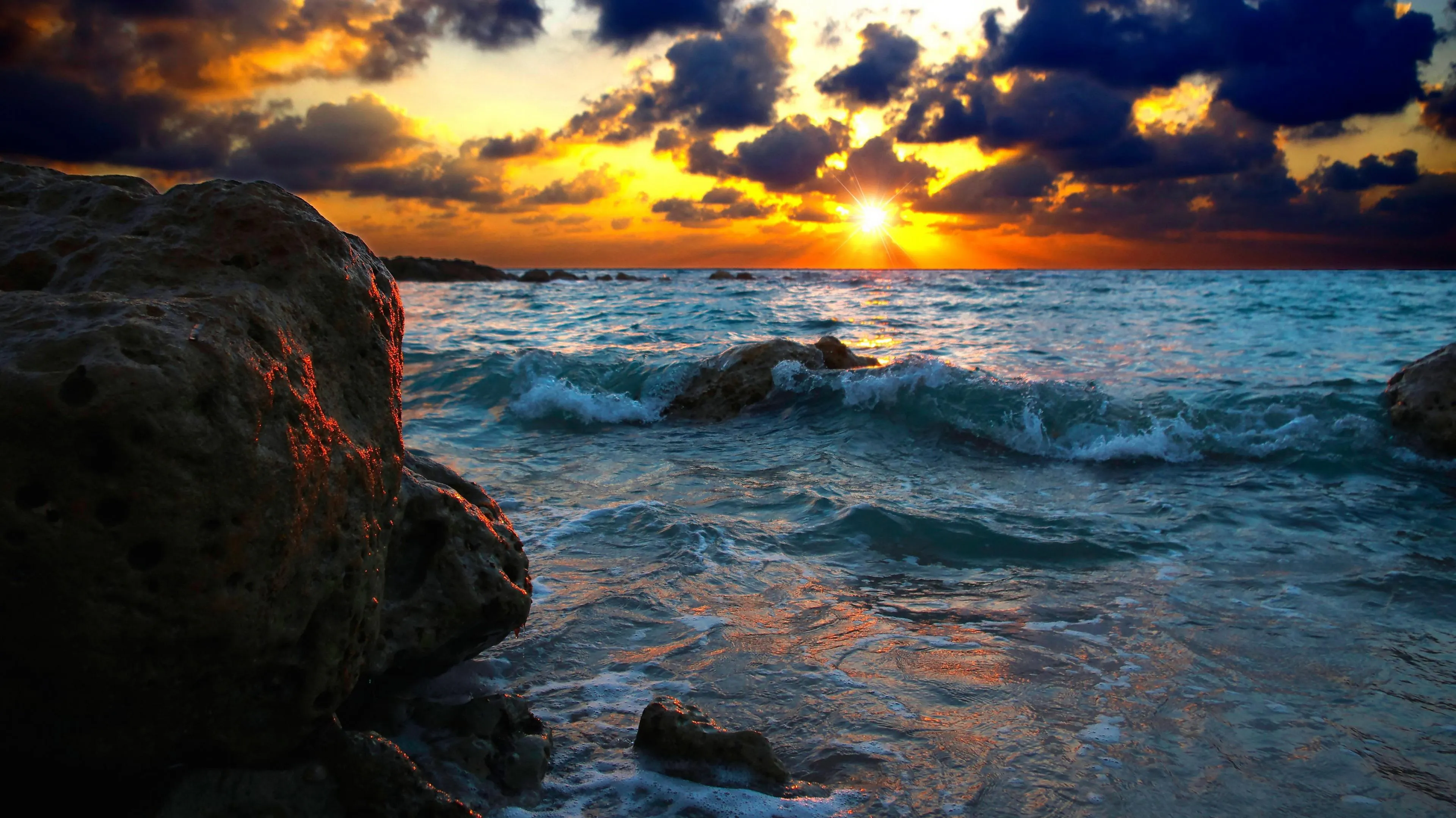 Rocky Beach at Sunset with Vibrant Colorful Sky Wallpaper