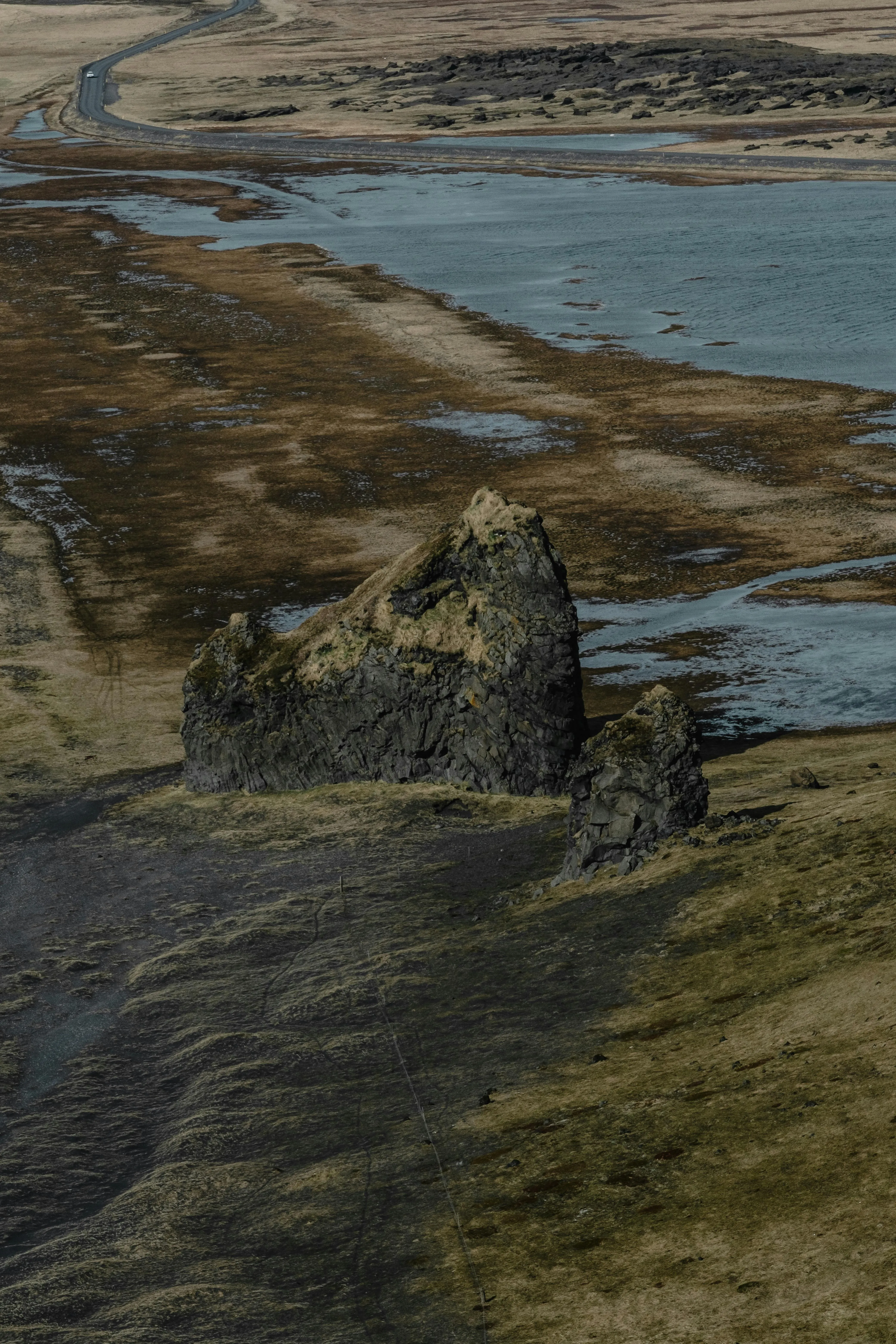 Rocky Coastal Cliffs with Brown Grass and the Ocean Image