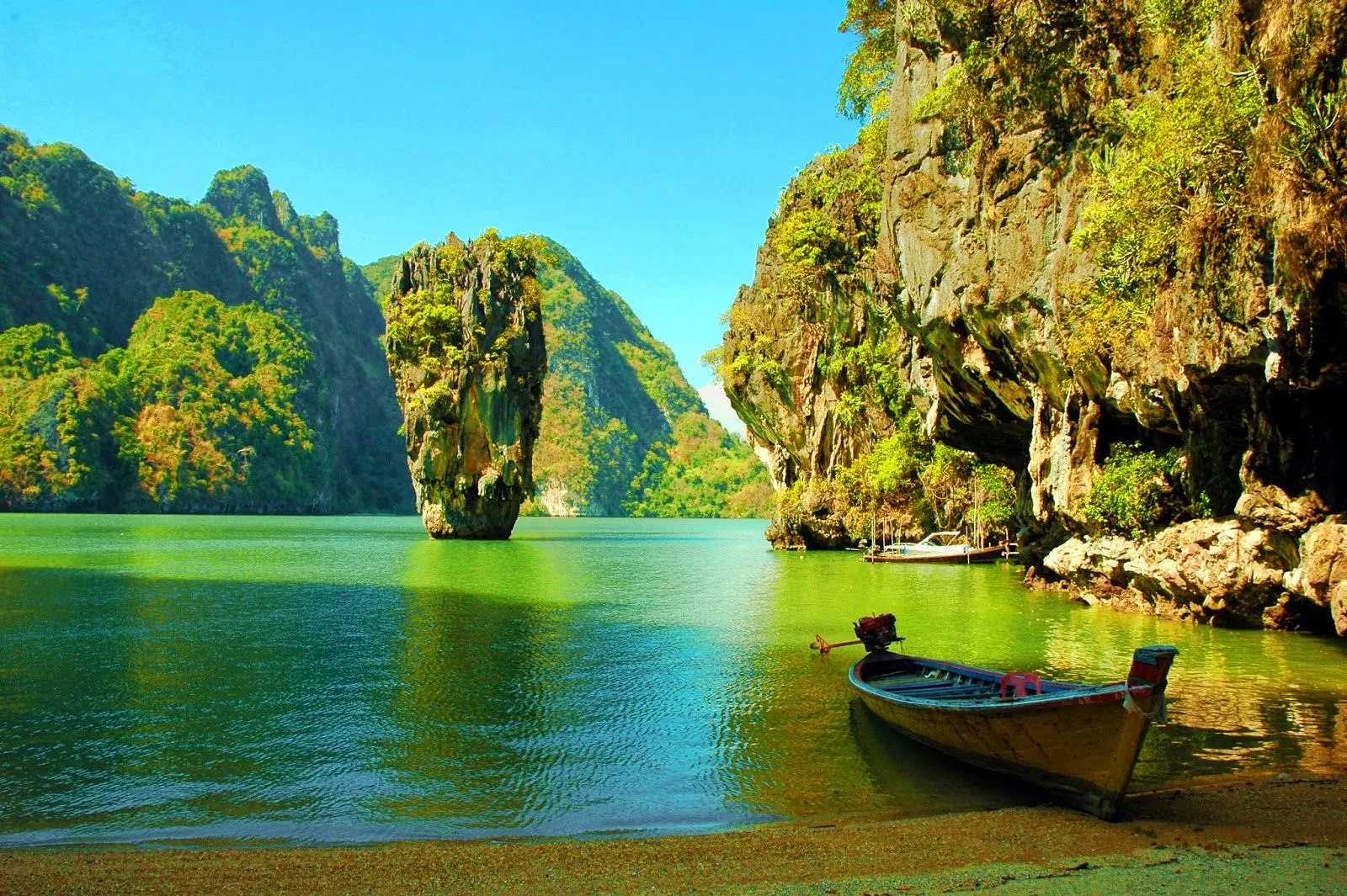 Scenic Limestone Cliffs with a Canoe on Calm Green Water