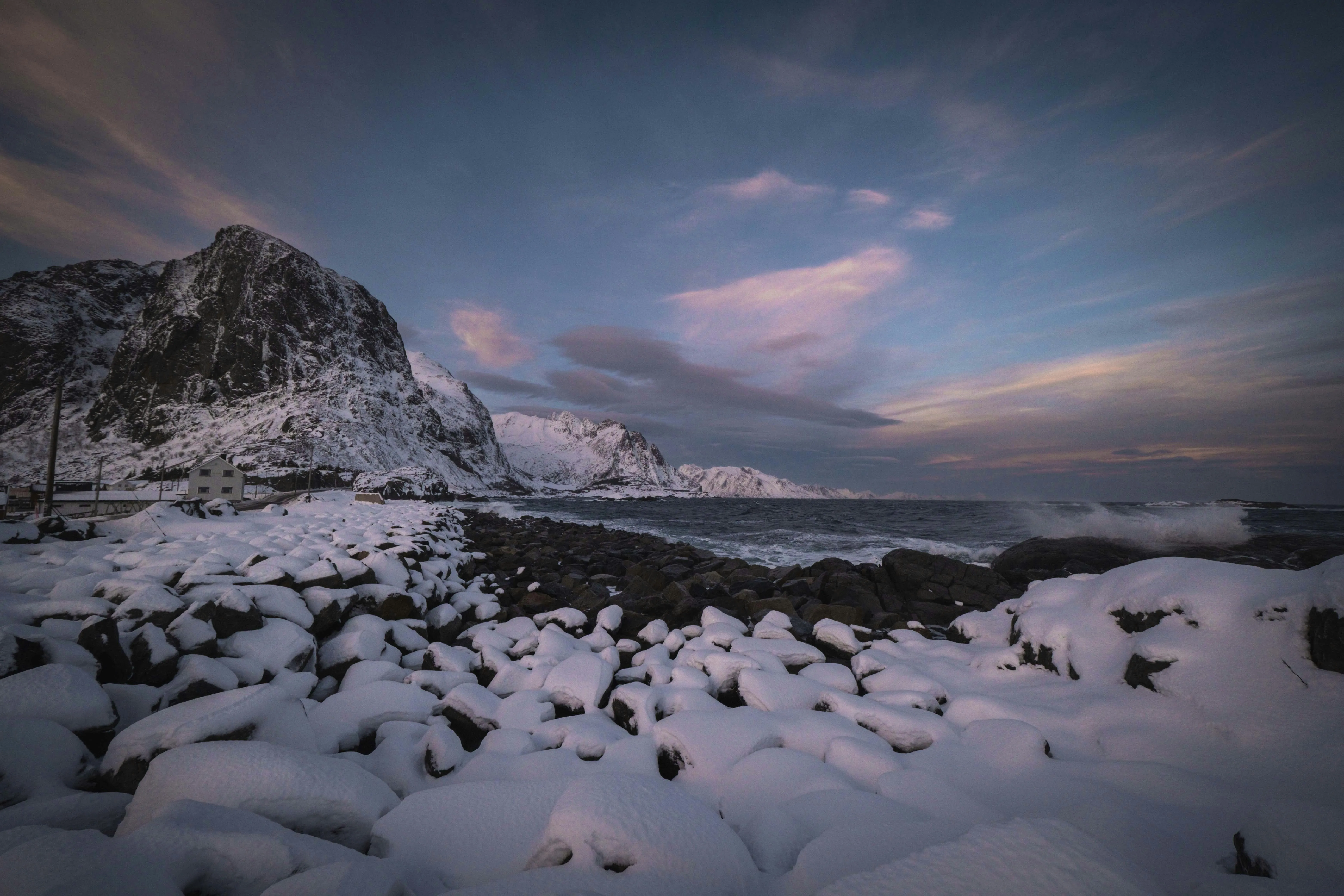 Snow Covered Beach Under a Soft Purple Sunset Sky Wallpaper