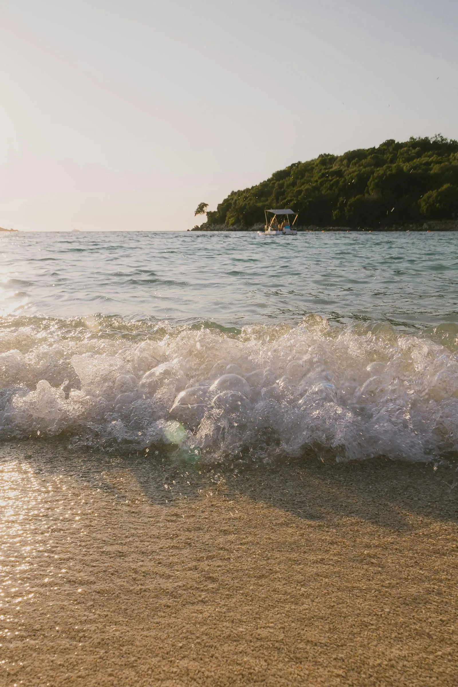 Soft Waves Gently Touch the Sandy Beach Free Wallpaper