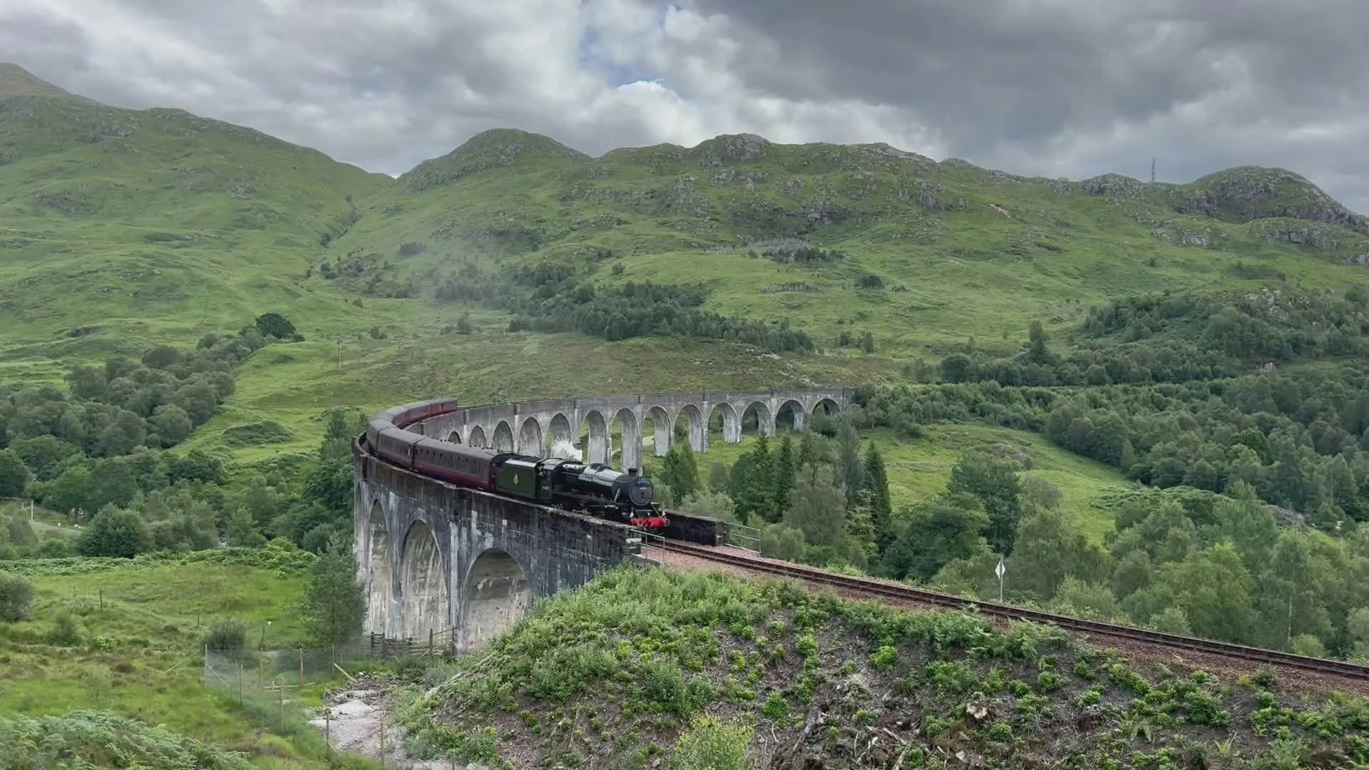 Steam Train Crossing the Stone Bridge Iconic Scene Wallpaper