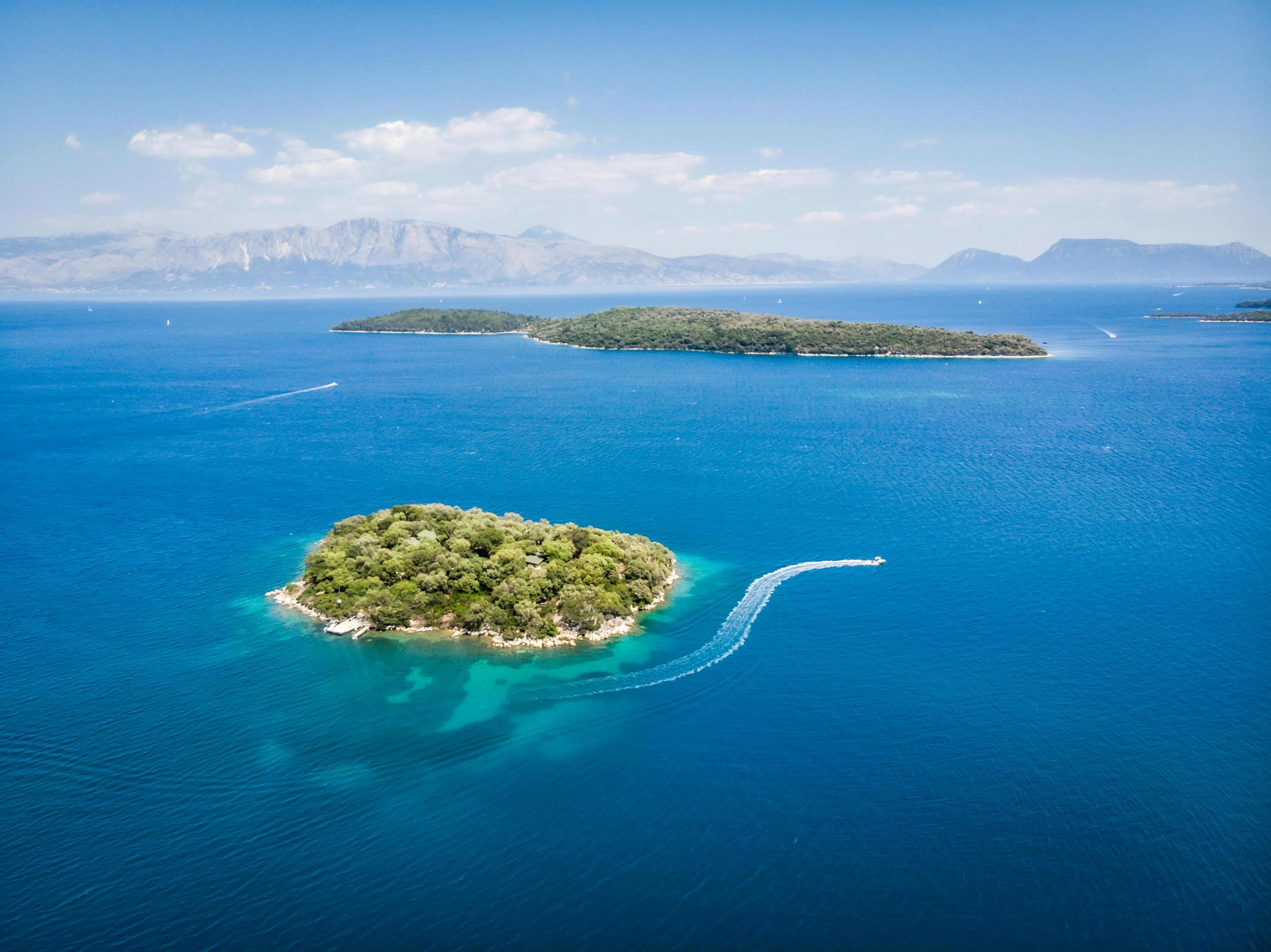 Stunning Small Green Island Floating Alone in a Blue Ocean