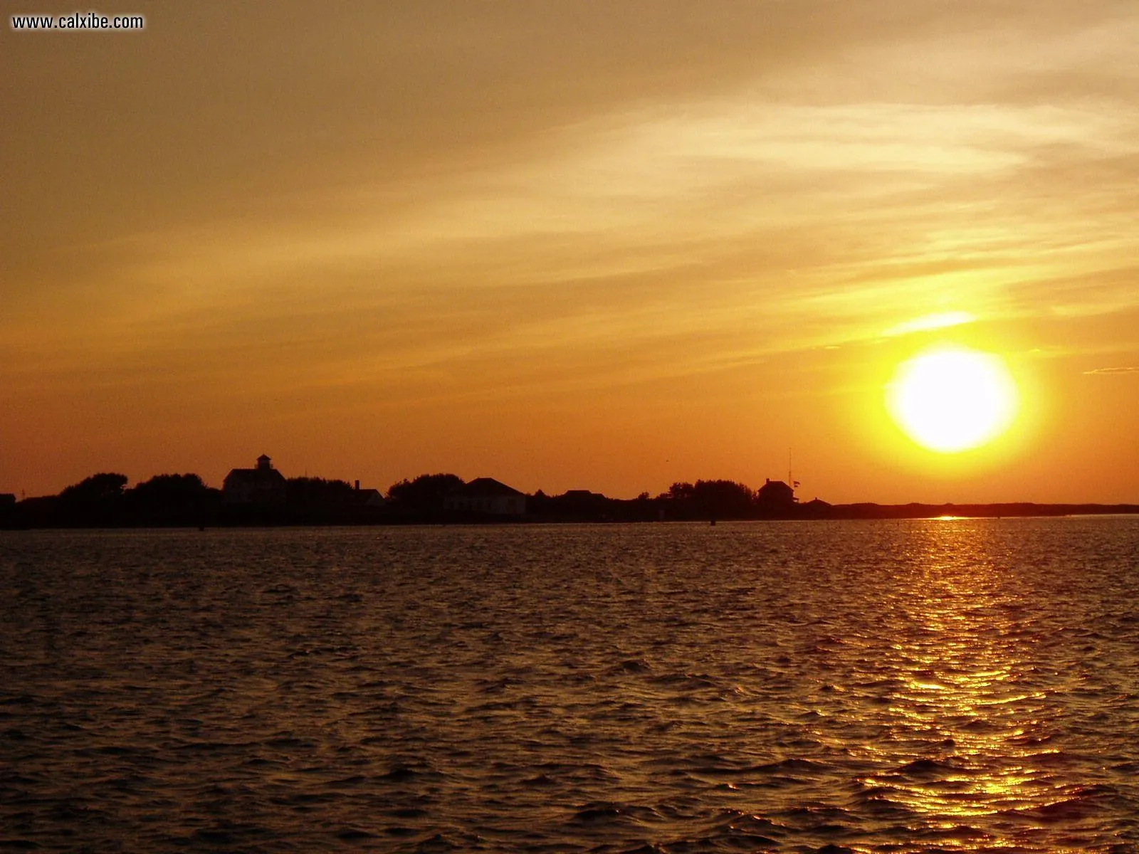 Sunset View over the Ocean with Glowing Orange Reflections