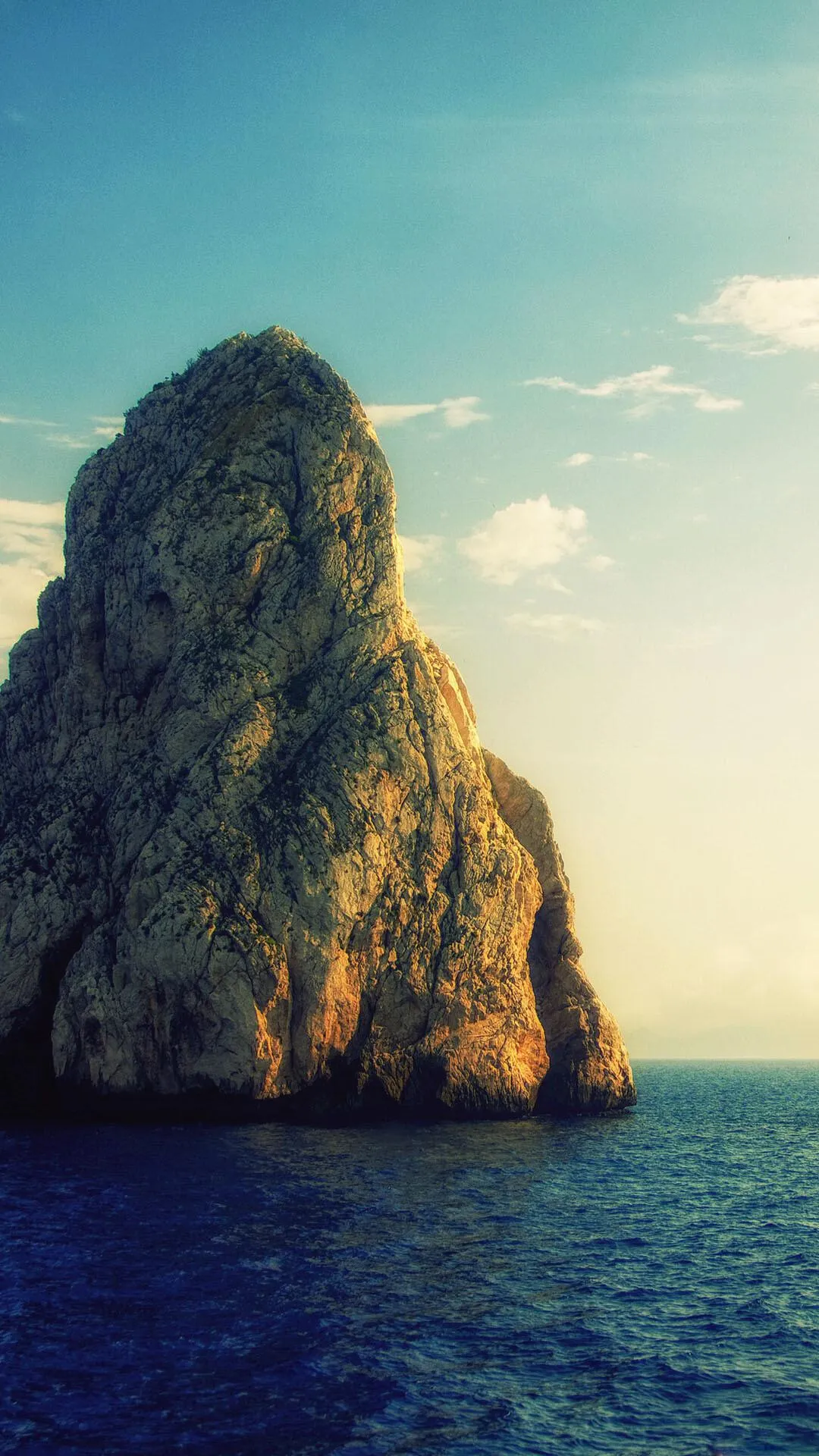 Tall Rock Formation Rising Dramatically from the Ocean