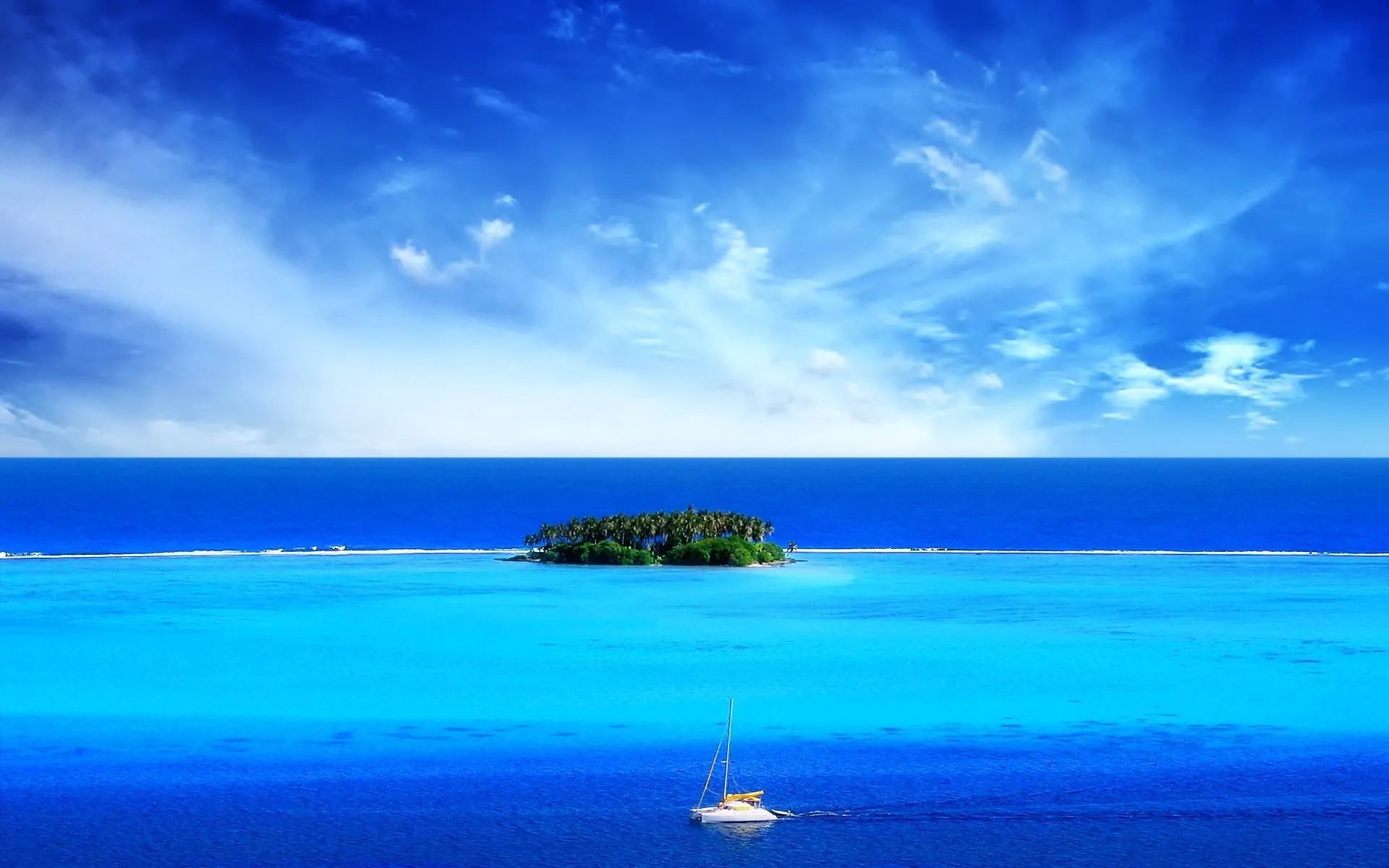 Tiny Island Floating in a Clear Blue Ocean HD Free Wallpaper